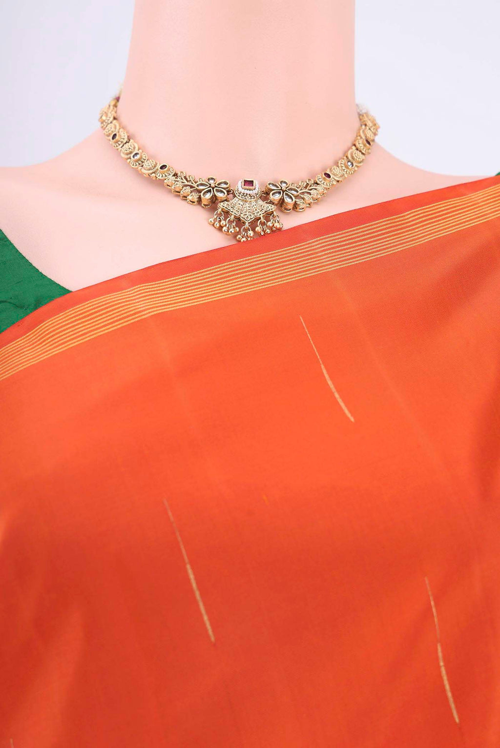 Border image of Orange Kanchipuram Silk Saree with Half And Half on the body and Plain Border