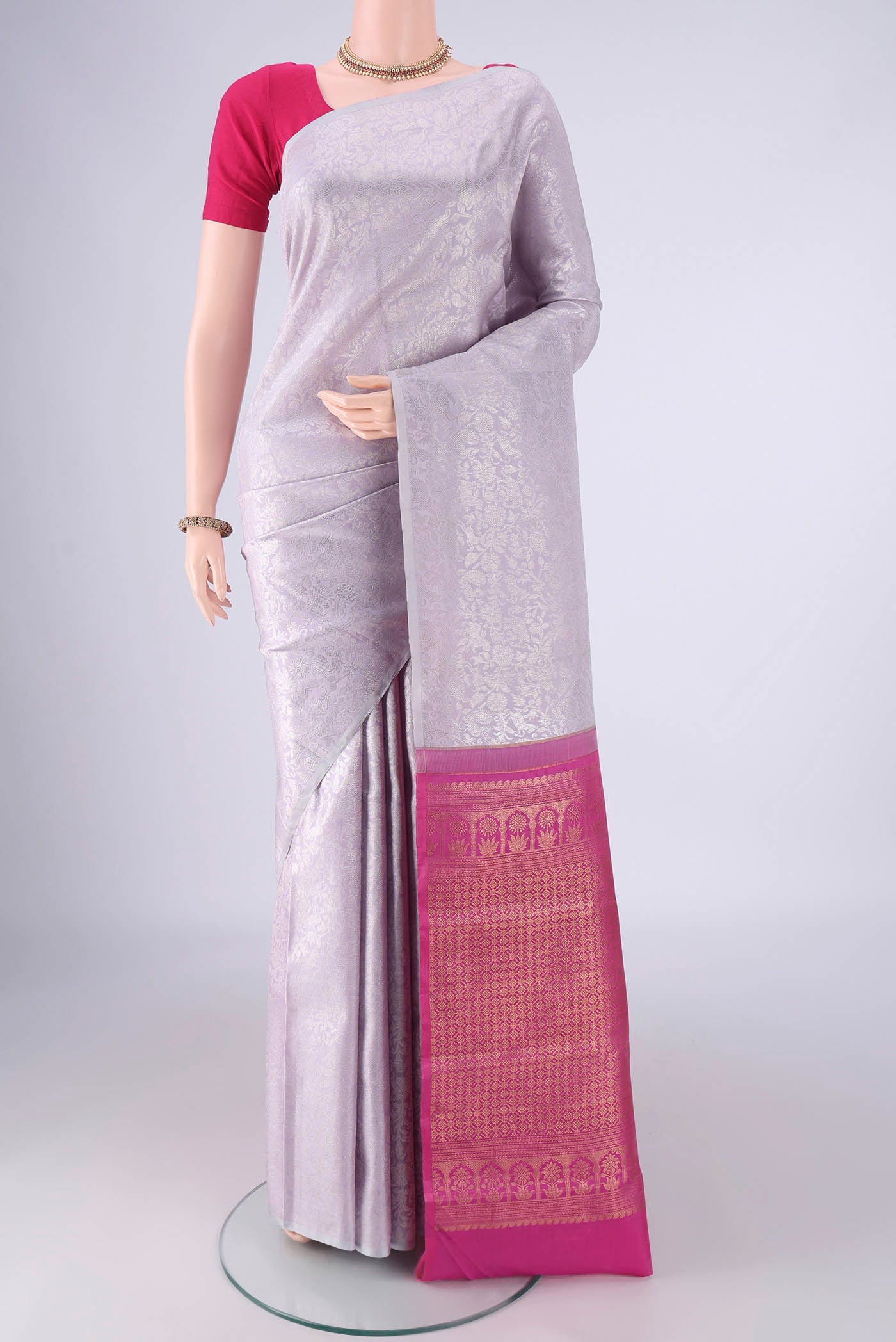 Lavender Kanjivaram Silk Saree with Zari Brocade on the body and Without Border.  displayed on a mannequin