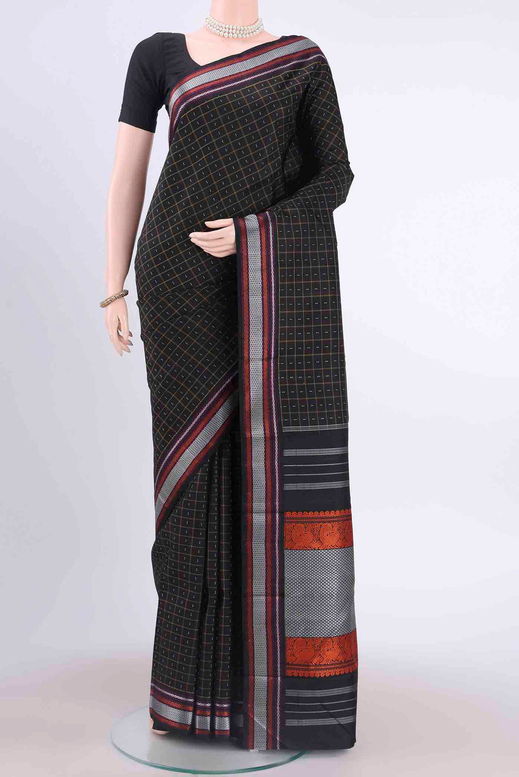 Black Kanchipuram Silk Saree with Checked design on the body and Thread Border displayed on a mannequin