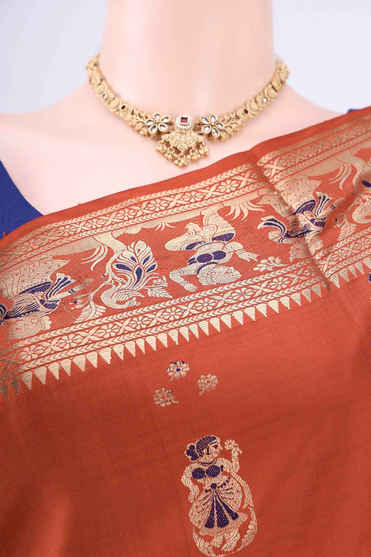 Border image of Rust Baluchari Silk Saree with Zari Butta on the body and Zari Border