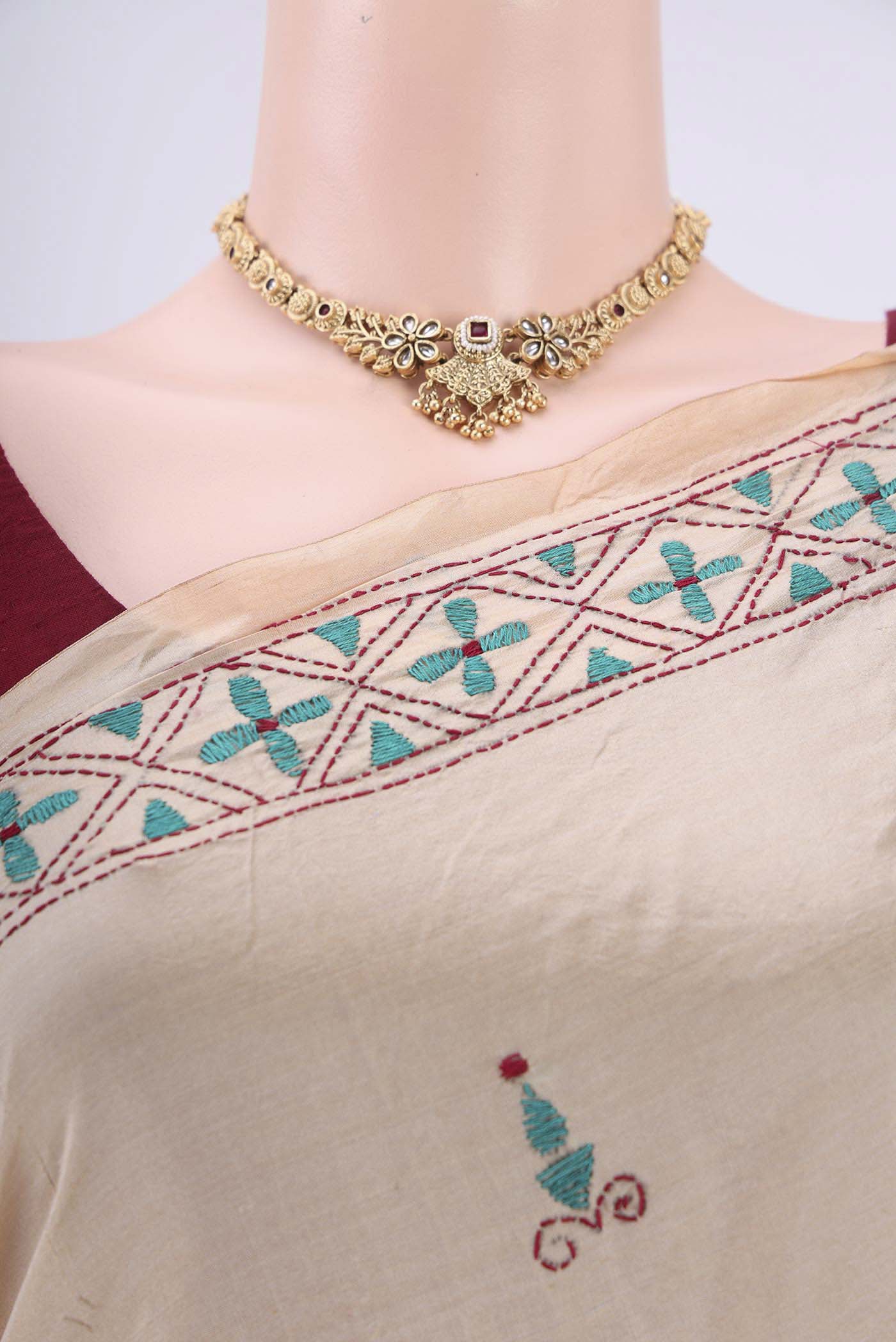 Border image of Beige Tussar Silk Saree with Kantha Work on the body and Embroidery Border. 