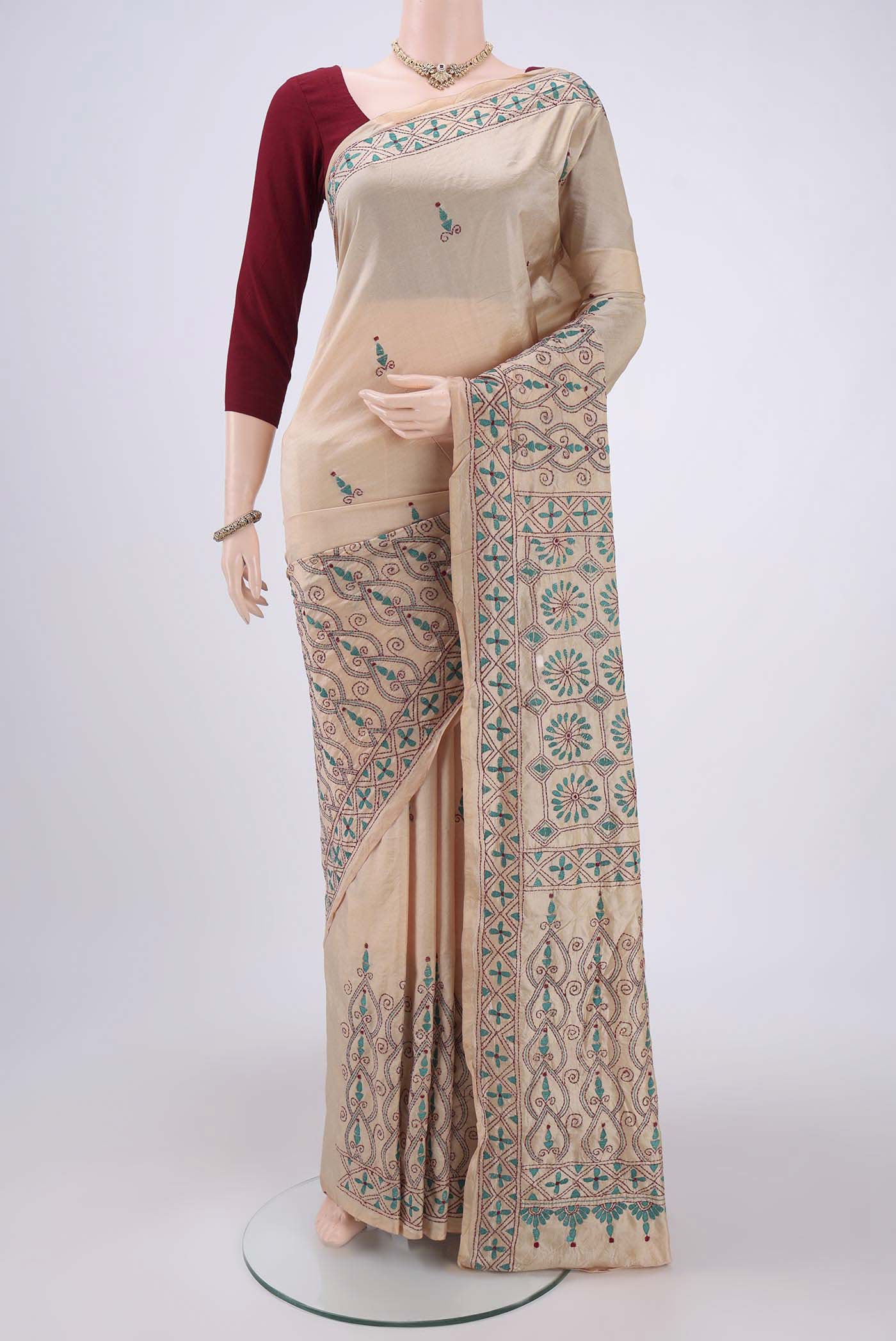 Beige Tussar Silk Saree with Kantha Work on the body and Embroidery Border.  displayed on a mannequin