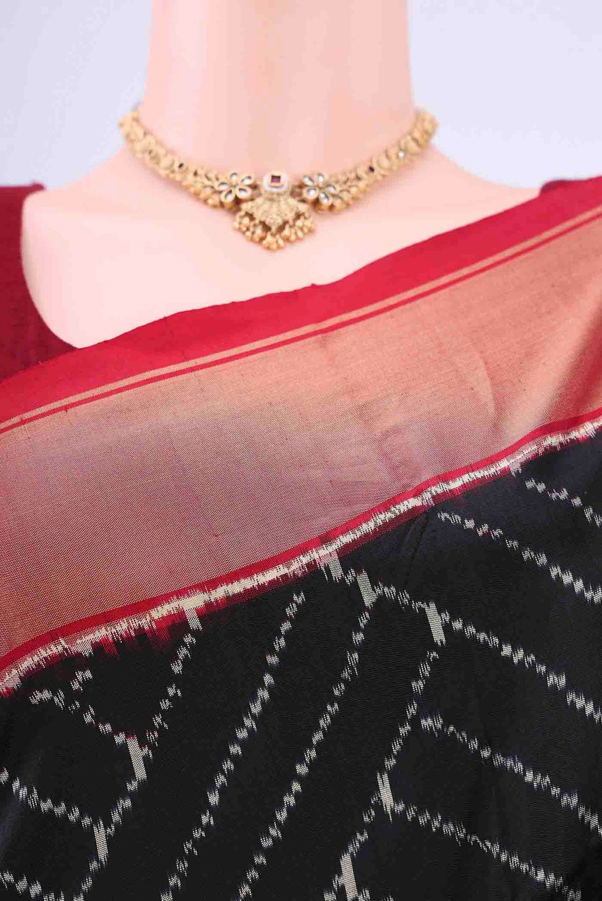 Border image of Black Pochampally Silk Saree with Ikat design on the body and Zari Border