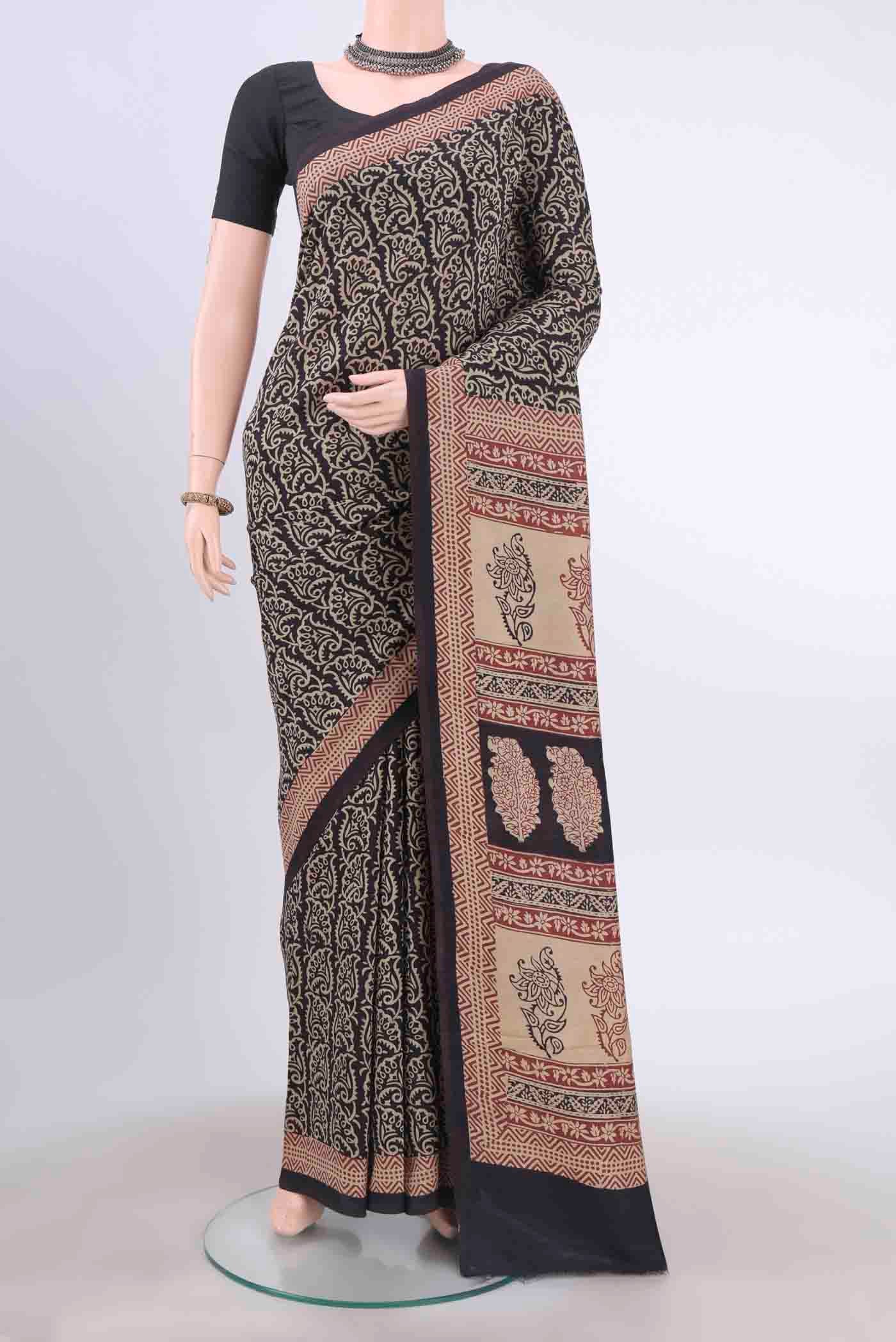 Black Tussar Silk Saree with Printed design on the body and Printed Border displayed on a mannequin