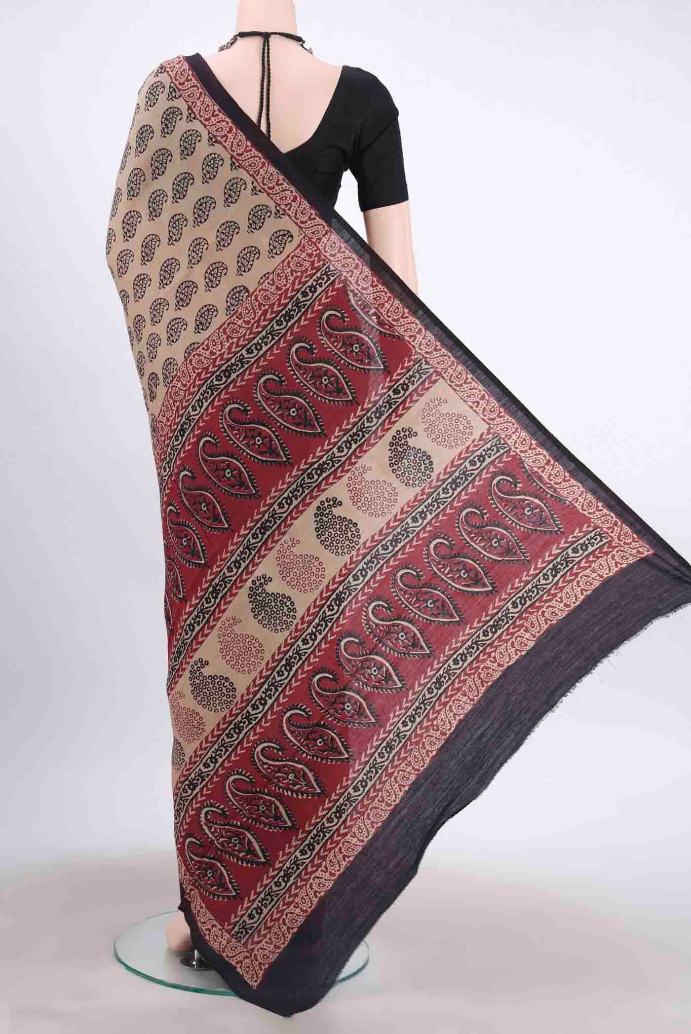 Flat view of Beige Tussar Silk Saree with Printed design on the body and Printed Border