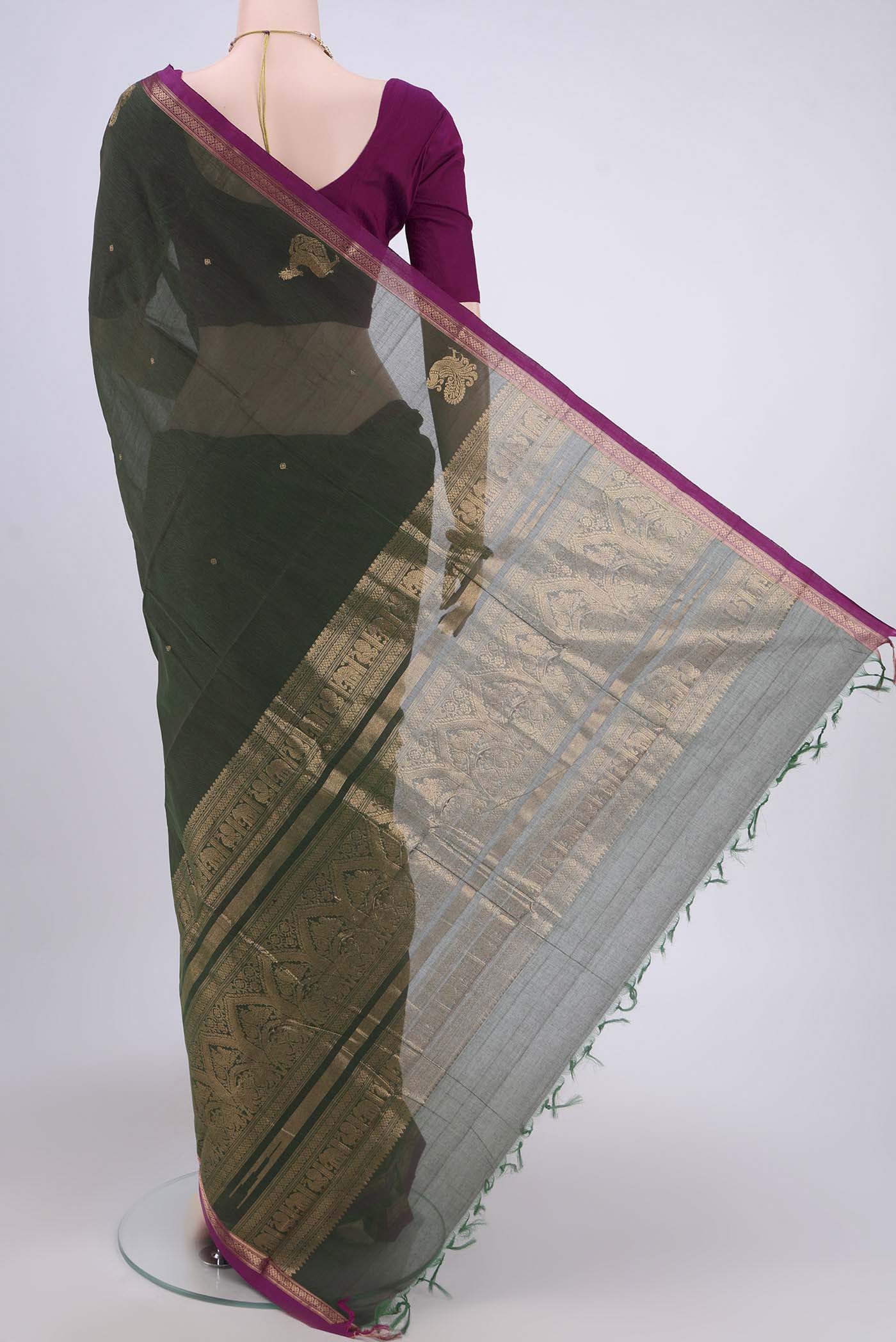 Flat view of Green Kanchi Cotton Saree with Zari Butta on the body and Zari Border. 
