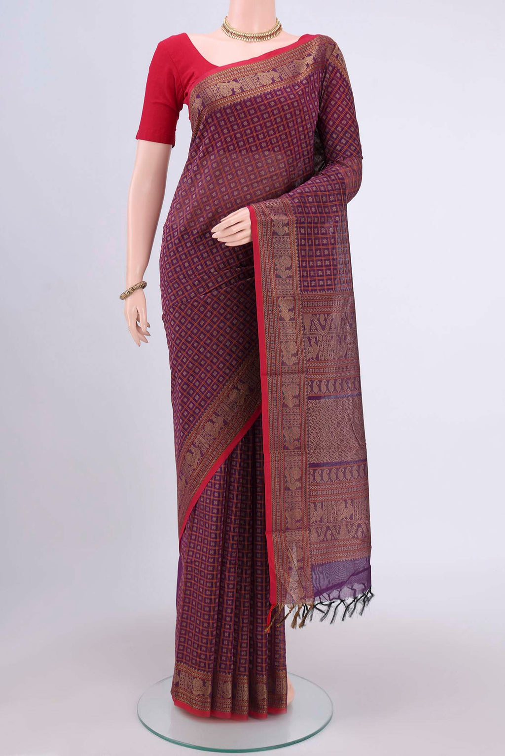 Dark Mauve Kanchi Cotton Saree with Checked design on the body and Thread Border.  displayed on a mannequin