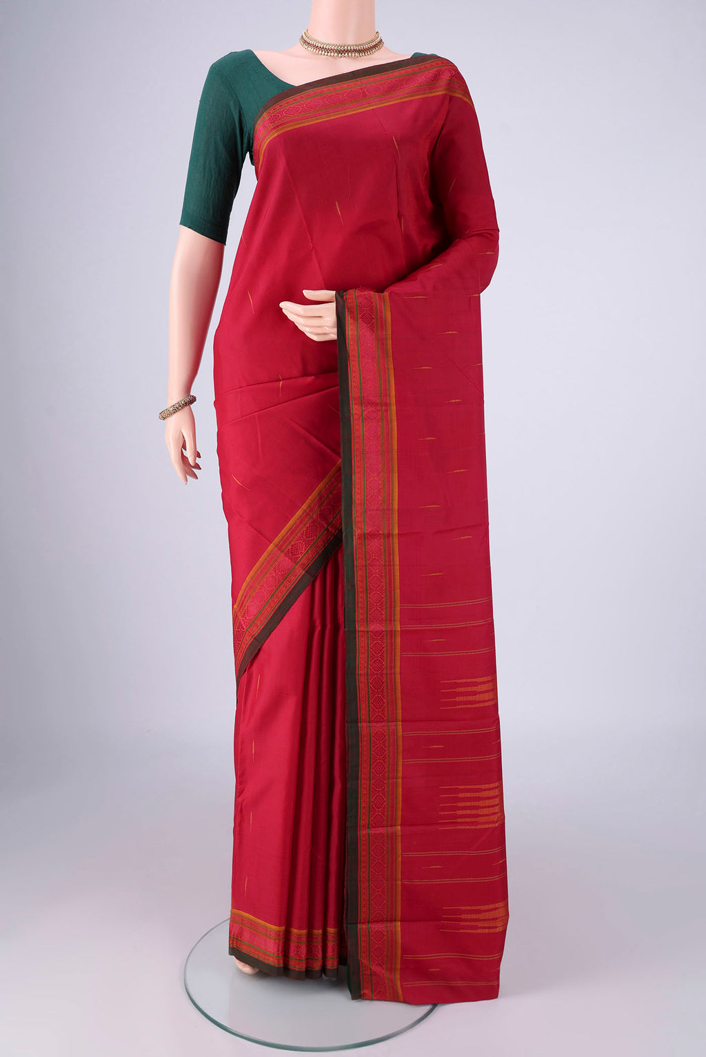 Maroon Kanchipuram Silk Saree with Thread Butta on the body and Thread Border.  displayed on a mannequin