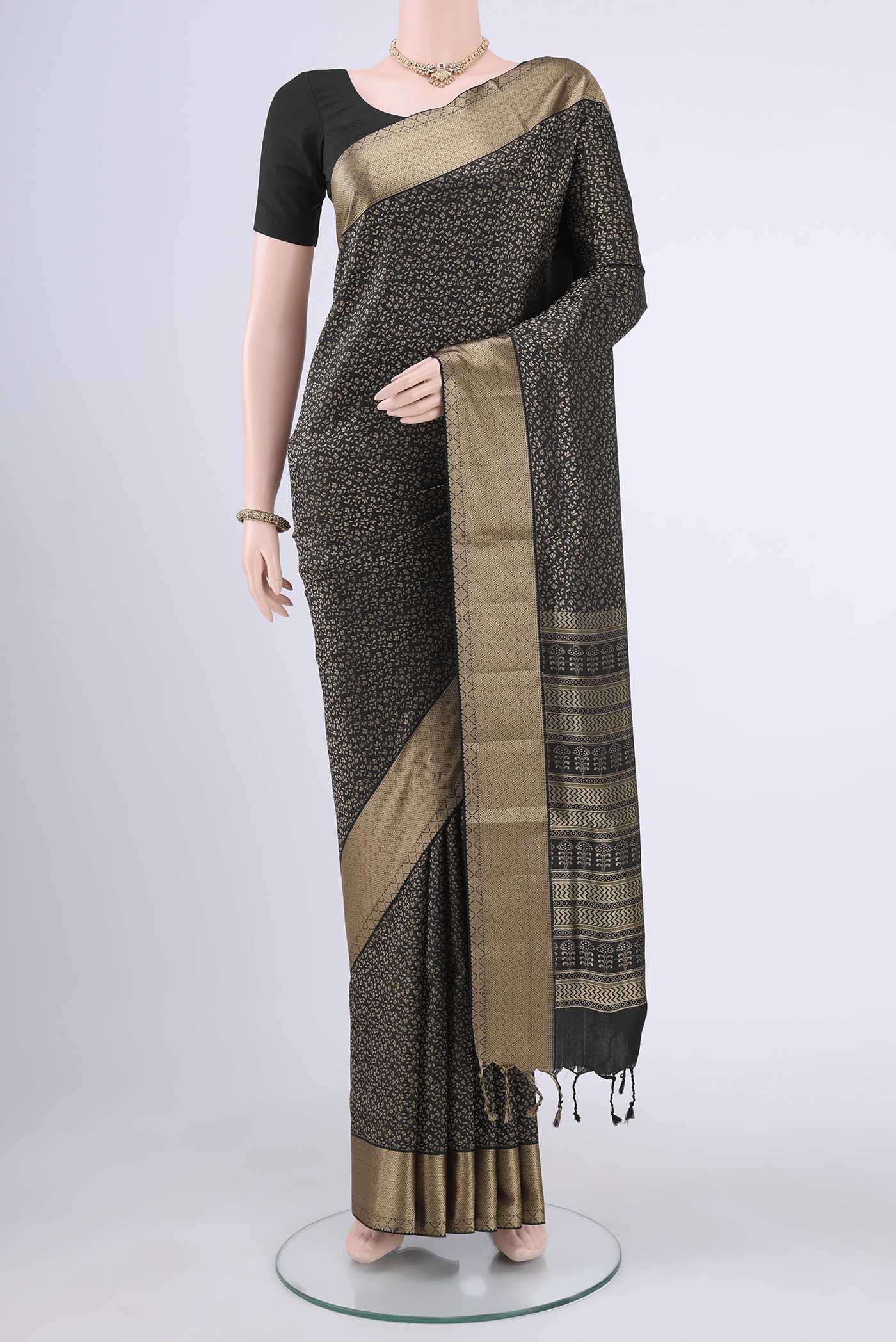 Black Soft Silk Saree with Jacquard design on the body and Thread Border displayed on a mannequin