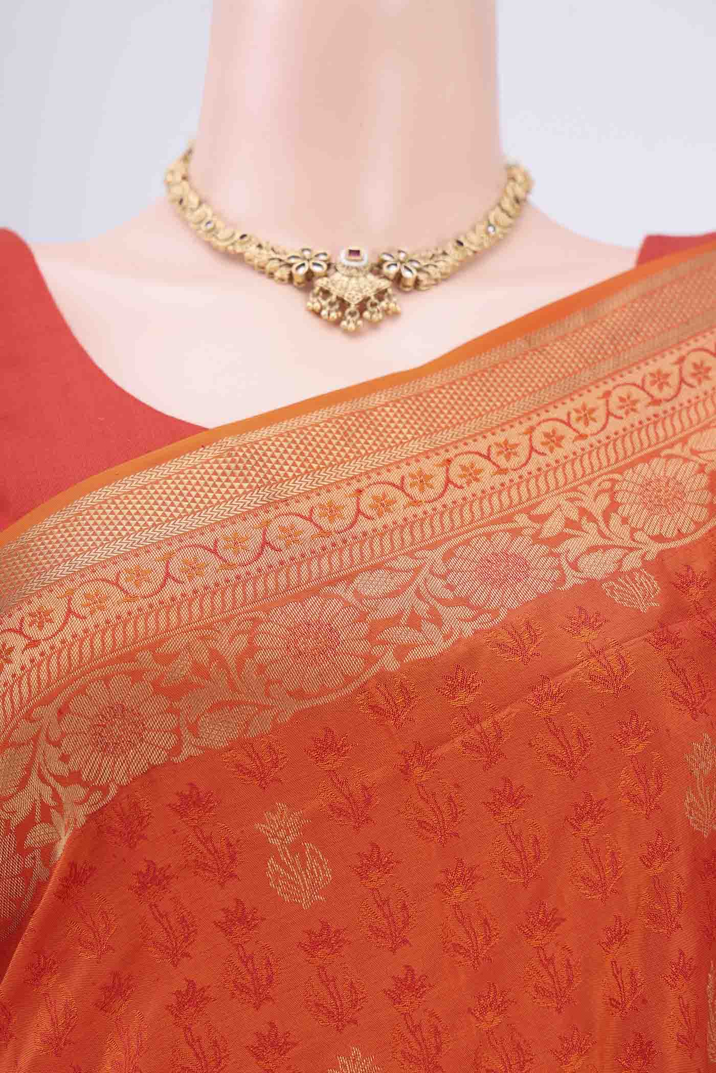 Border image of Orange Soft Silk Saree with Jacquard design on the body and Thread Border. 