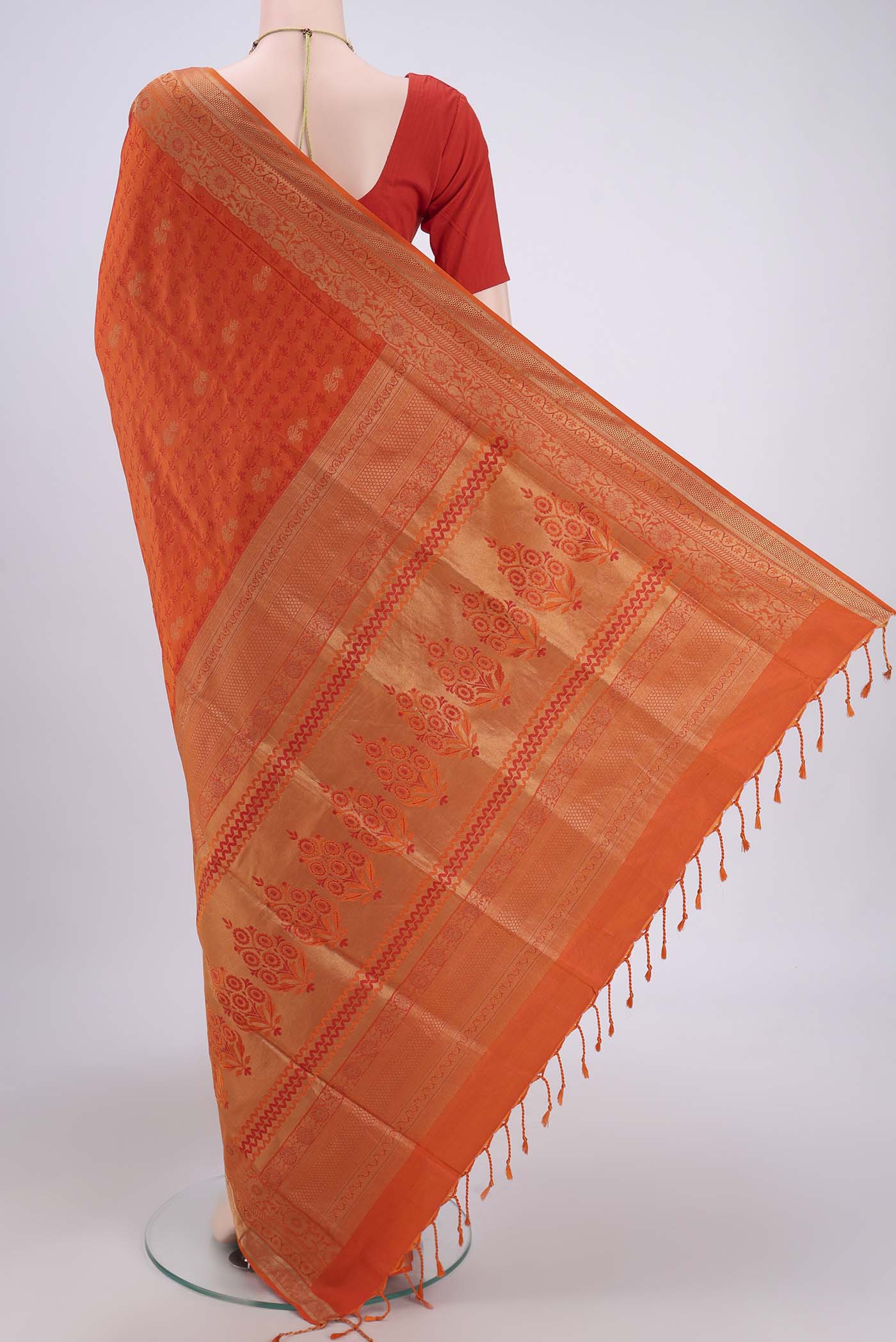 Flat view of Orange Soft Silk Saree with Jacquard design on the body and Thread Border. 