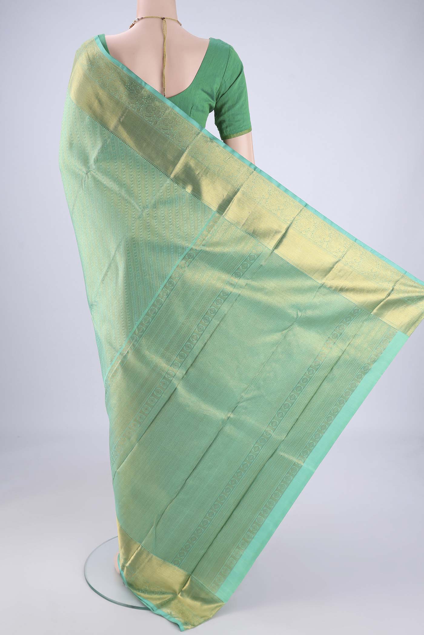 Flat view of Sea Green Kanjivaram Silk Saree with Zari Brocade on the body and Zari Border. 