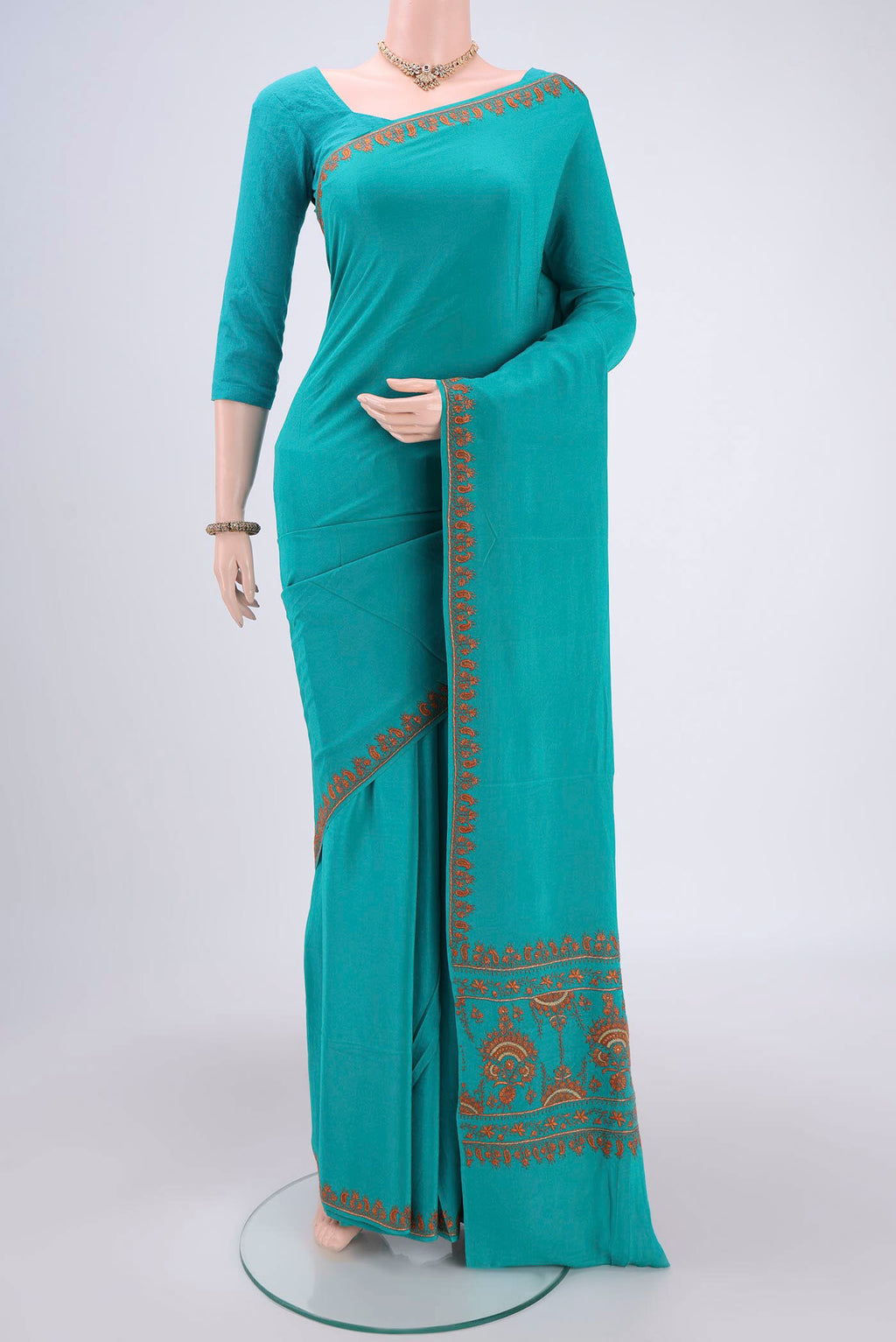 Turquoise Kashmiri Saree with Plain Body and Thread Border.  displayed on a mannequin