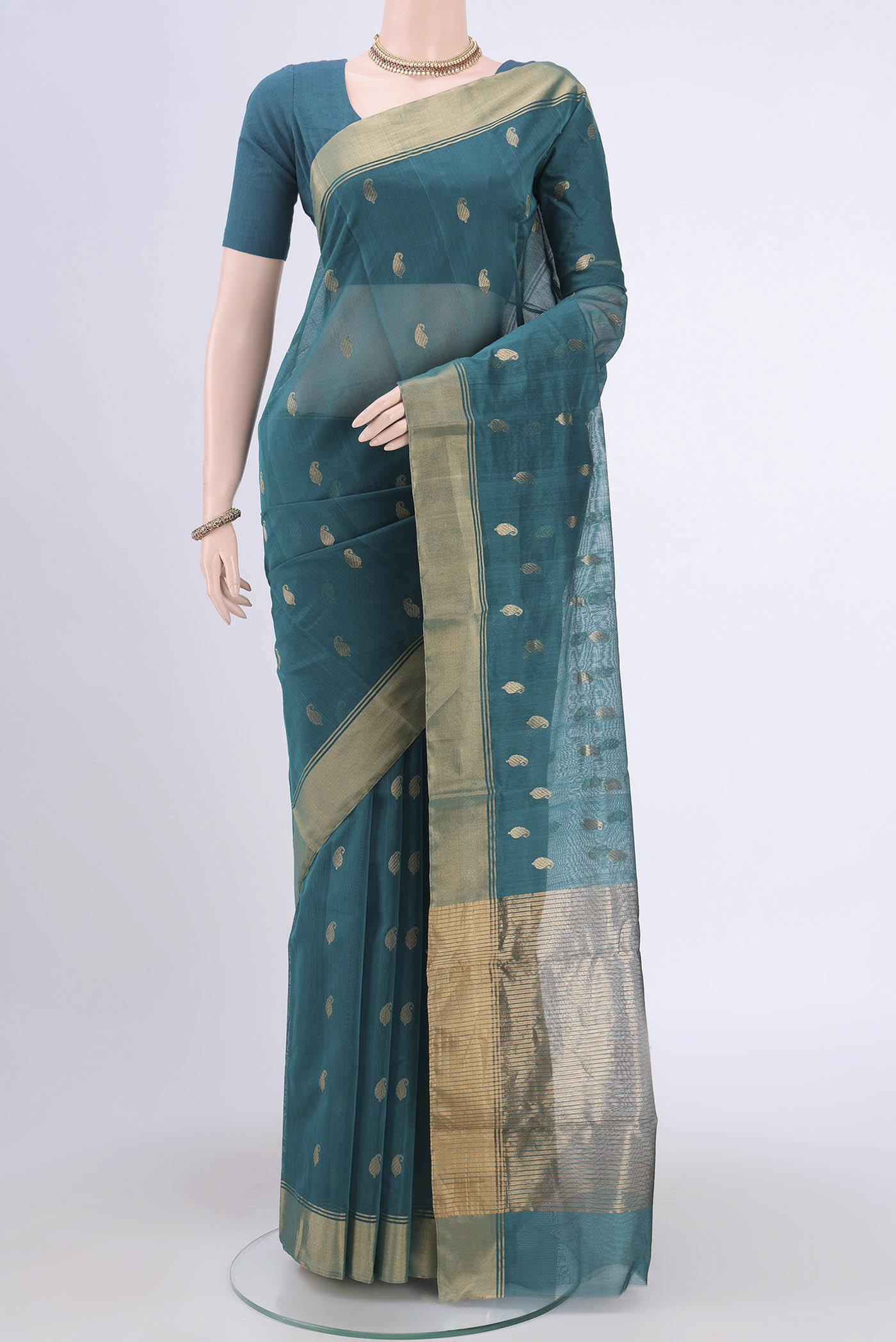 Sea Green Chanderi Silk Saree with Zari Butta on the body and Zari Border.  displayed on a mannequin
