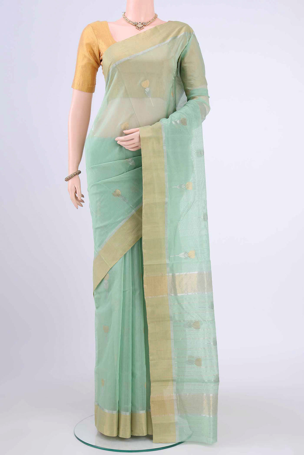 Light Green Chanderi Silk Saree with Zari Butta on the body and Zari Border displayed on a mannequin