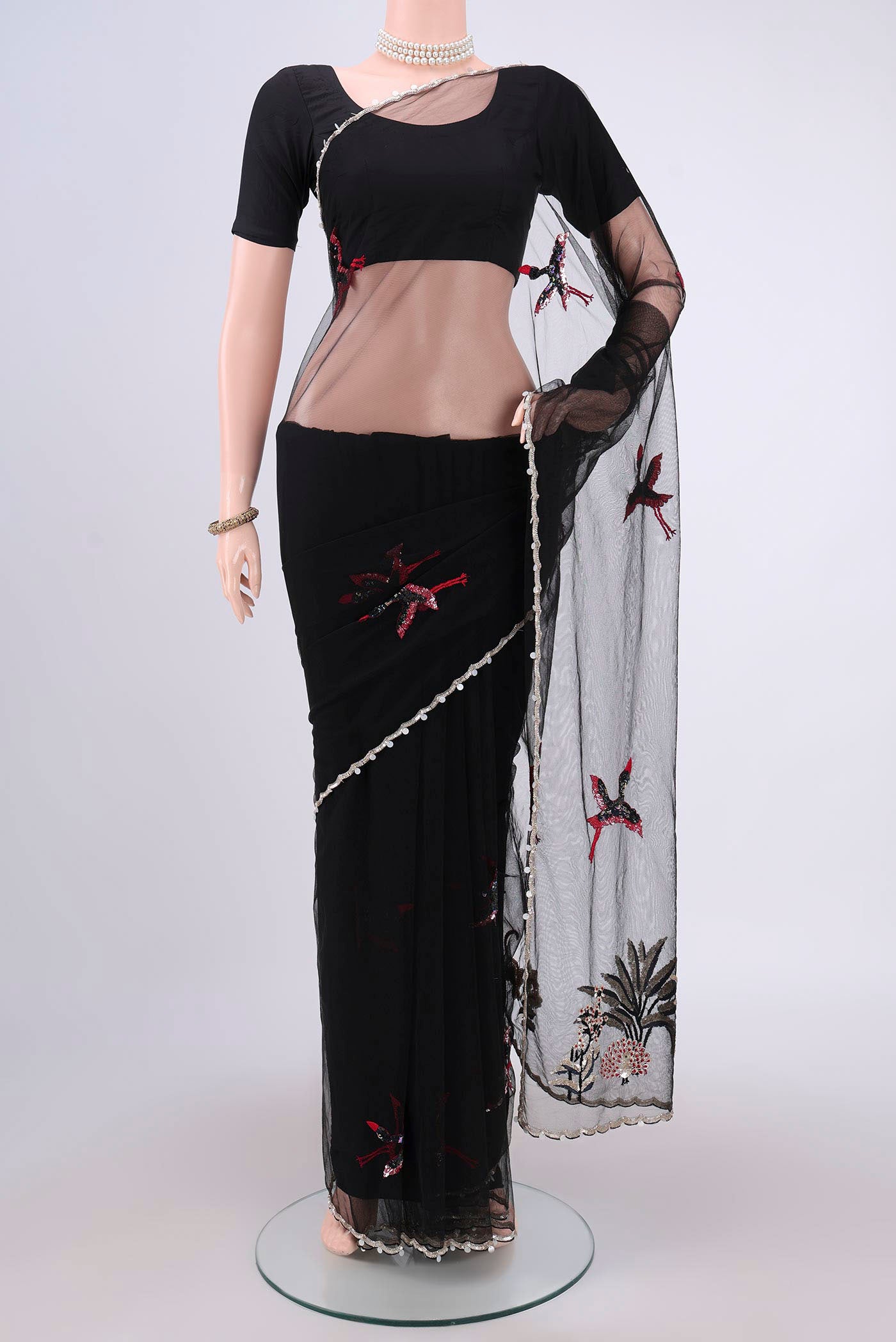 Black Organza Silk Saree with Embroidery on the body and Embroidery Border.  displayed on a mannequin