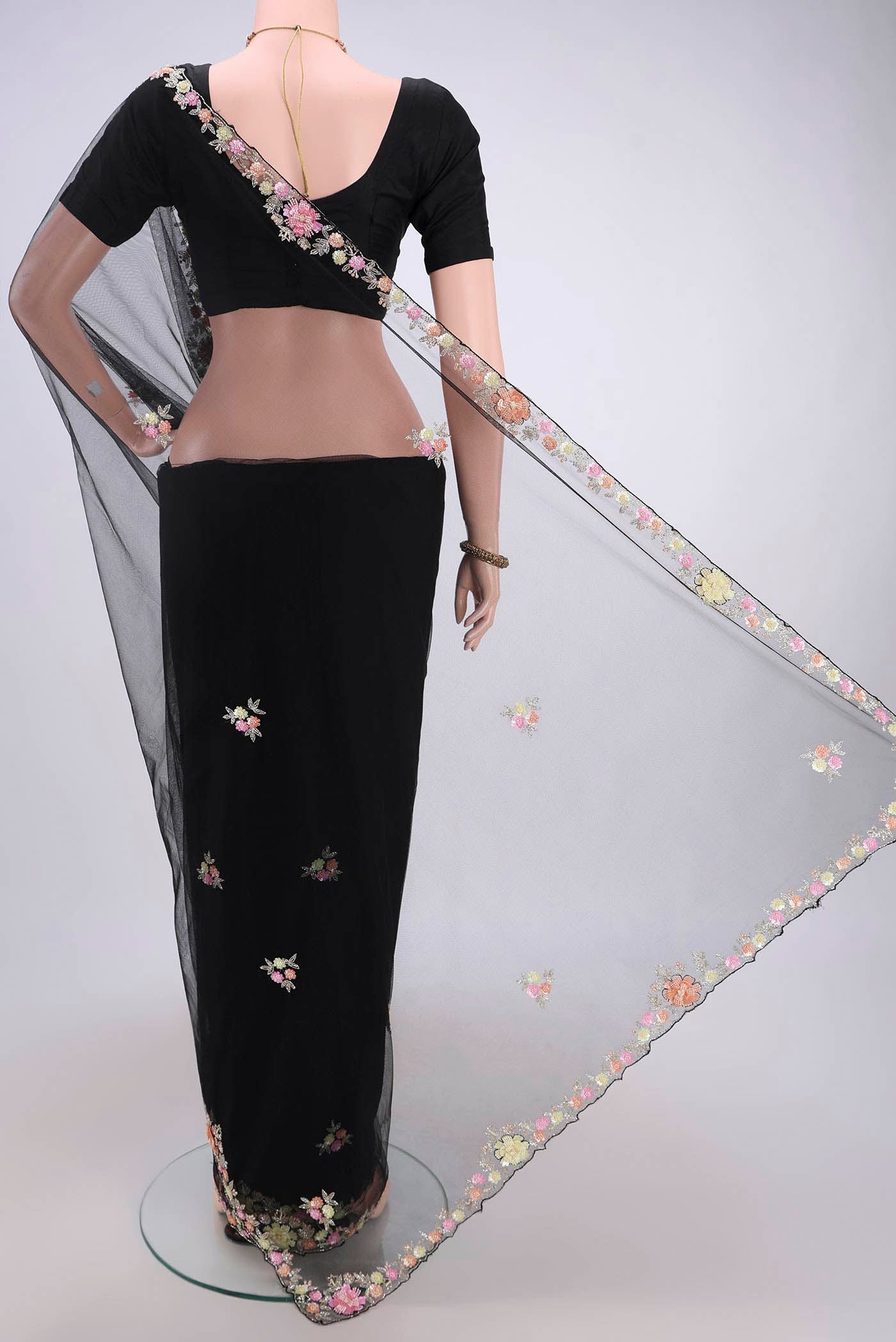 Flat view of Black Organza Silk Saree with Embroidery on the body and Embroidery Border. 