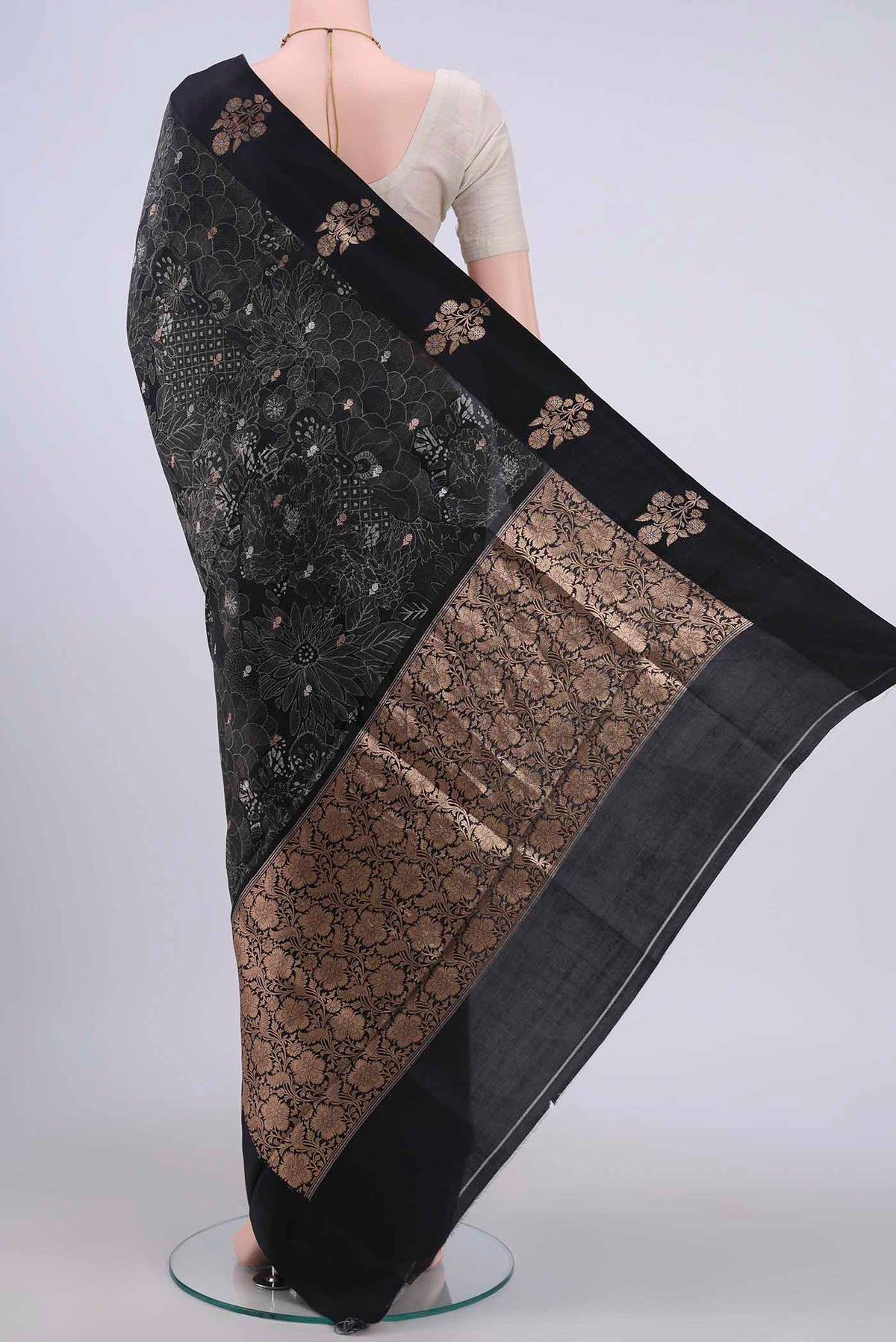 Flat view of Black Printed Silk Saree with Floral Print on the body and Zari Border