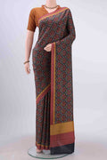 Black Printed Silk Saree with Printed design on the body and Plain Border displayed on a mannequin
