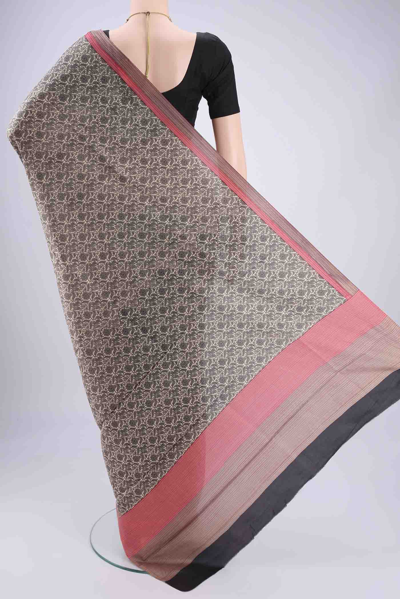 Flat view of Off White Printed Silk Saree with Floral Print on the body and Printed Border. 