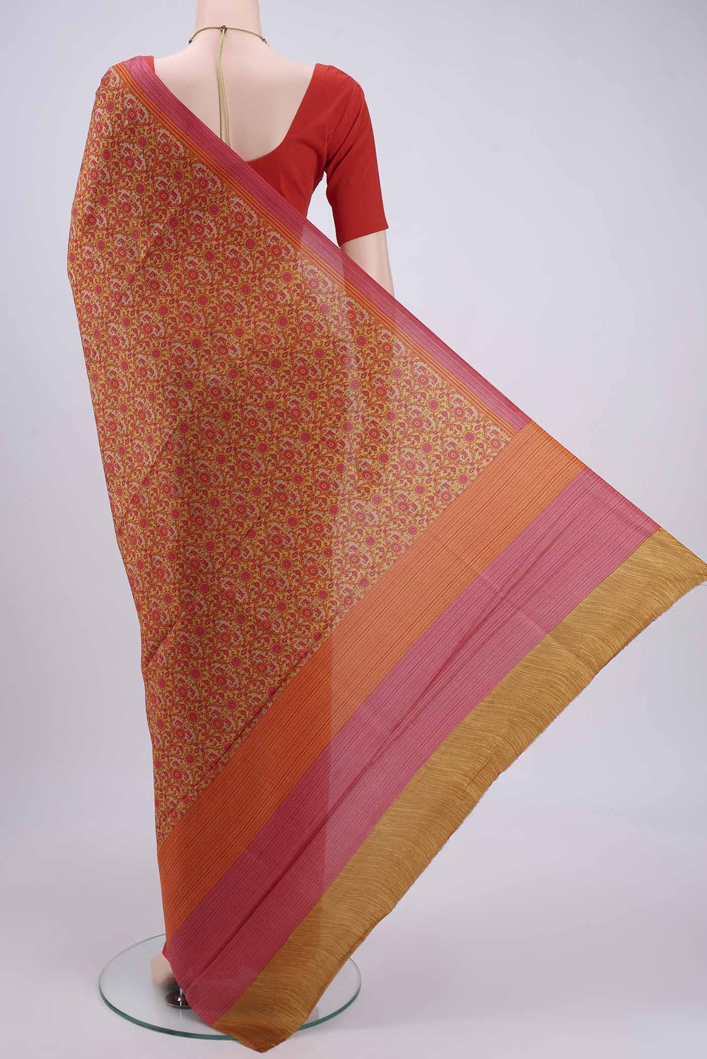 Flat view of Mustard Printed Silk Saree with Printed design on the body and Plain Border. 