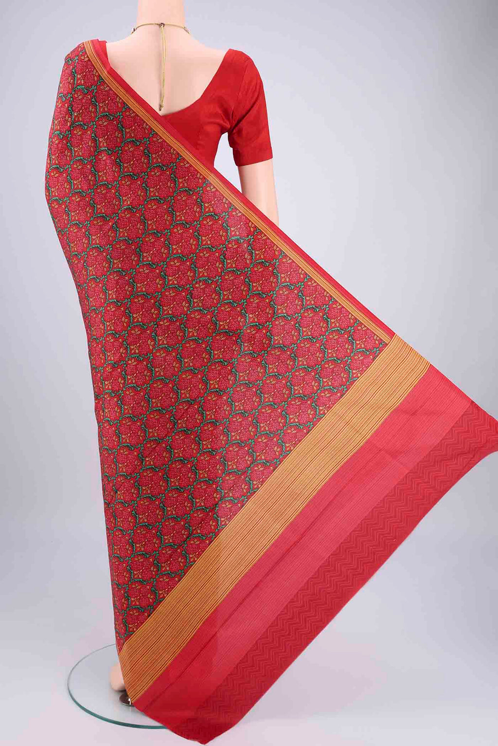 Flat view of Red Printed Silk Saree with Floral Print on the body and Printed Border. 