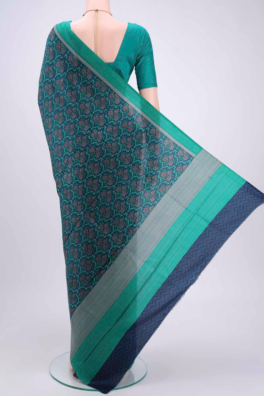 Flat view of Navy Blue Printed Silk Saree with Printed design on the body and Plain Border. 