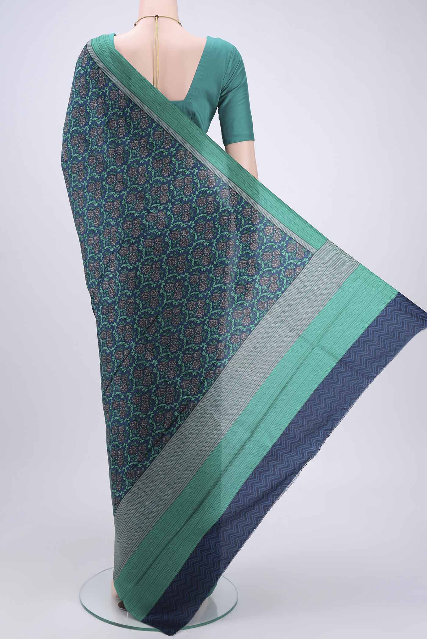 Flat view of Navy Blue Printed Silk Saree with Printed design on the body and Plain Border. 