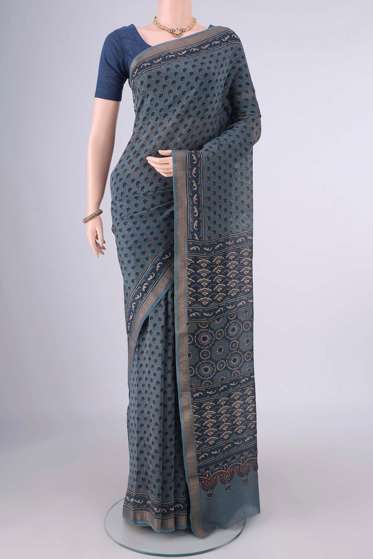 Indigo Chanderi Cotton Saree with Ajrakh Print on the body and Zari Border.  displayed on a mannequin