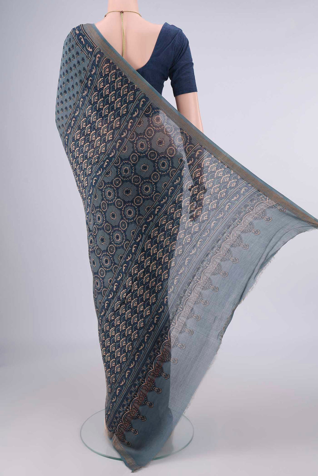 Flat view of Indigo Chanderi Cotton Saree with Ajrakh Print on the body and Zari Border. 