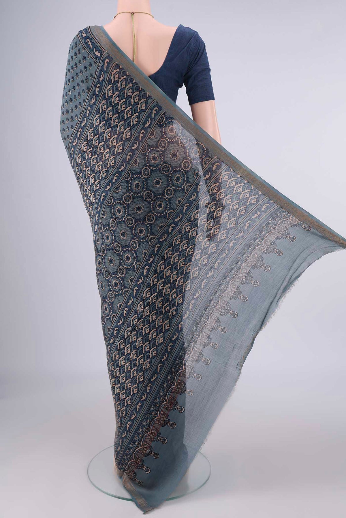 Flat view of Indigo Chanderi Cotton Saree with Ajrakh Print on the body and Zari Border. 