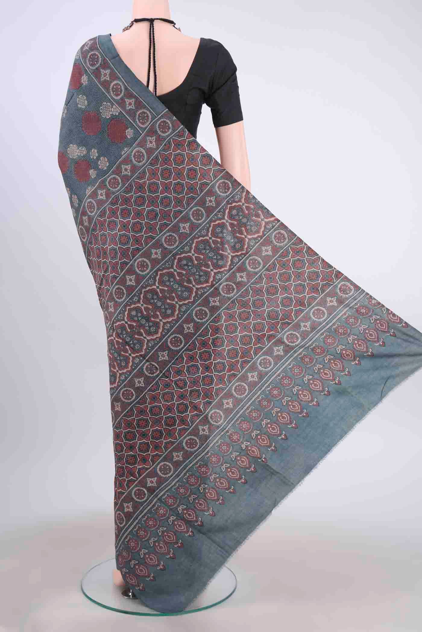 Flat view of Blue Grey Tussar Silk Saree with Ajrakh Print on the body and Printed Border