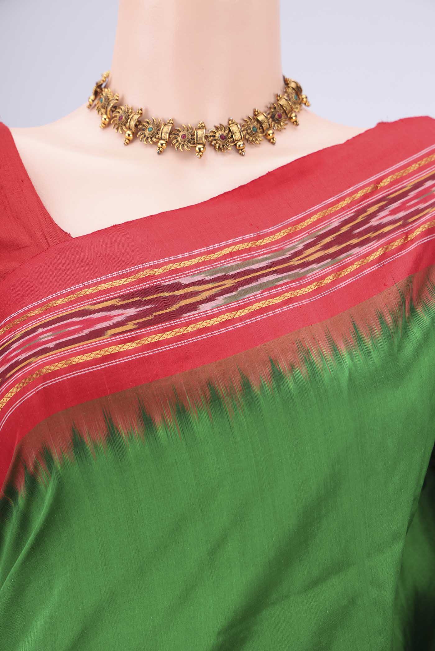Border image of Green Pochampally Silk Saree with Plain Body and Ikat Border. 