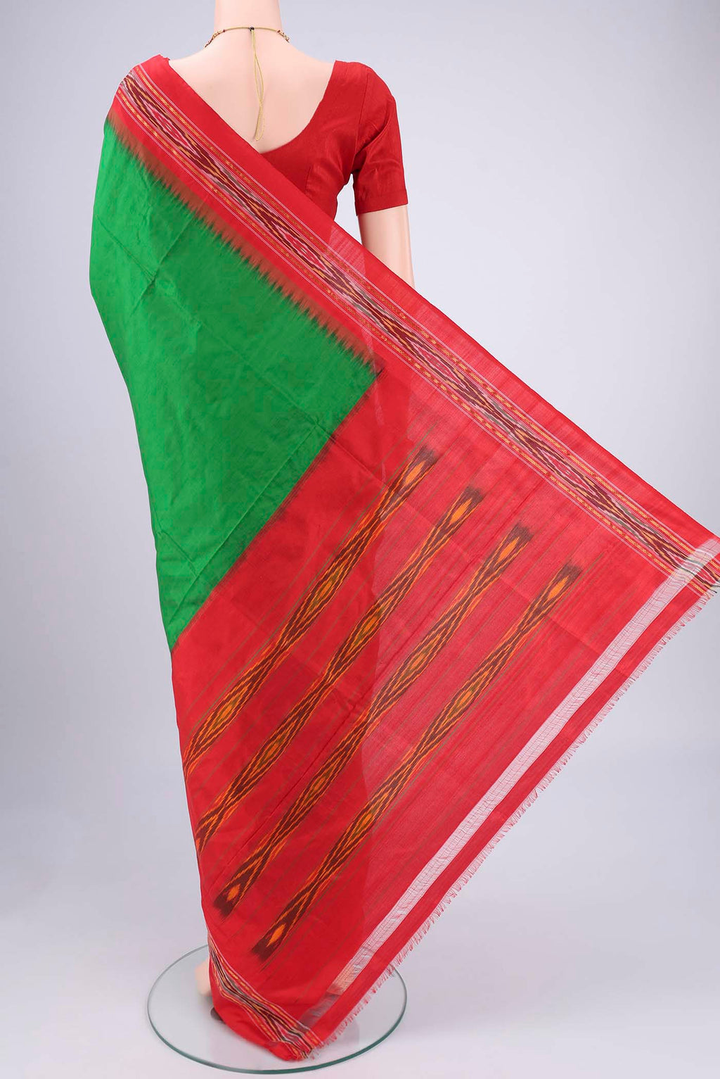 Flat view of Green Pochampally Silk Saree with Plain Body and Ikat Border. 