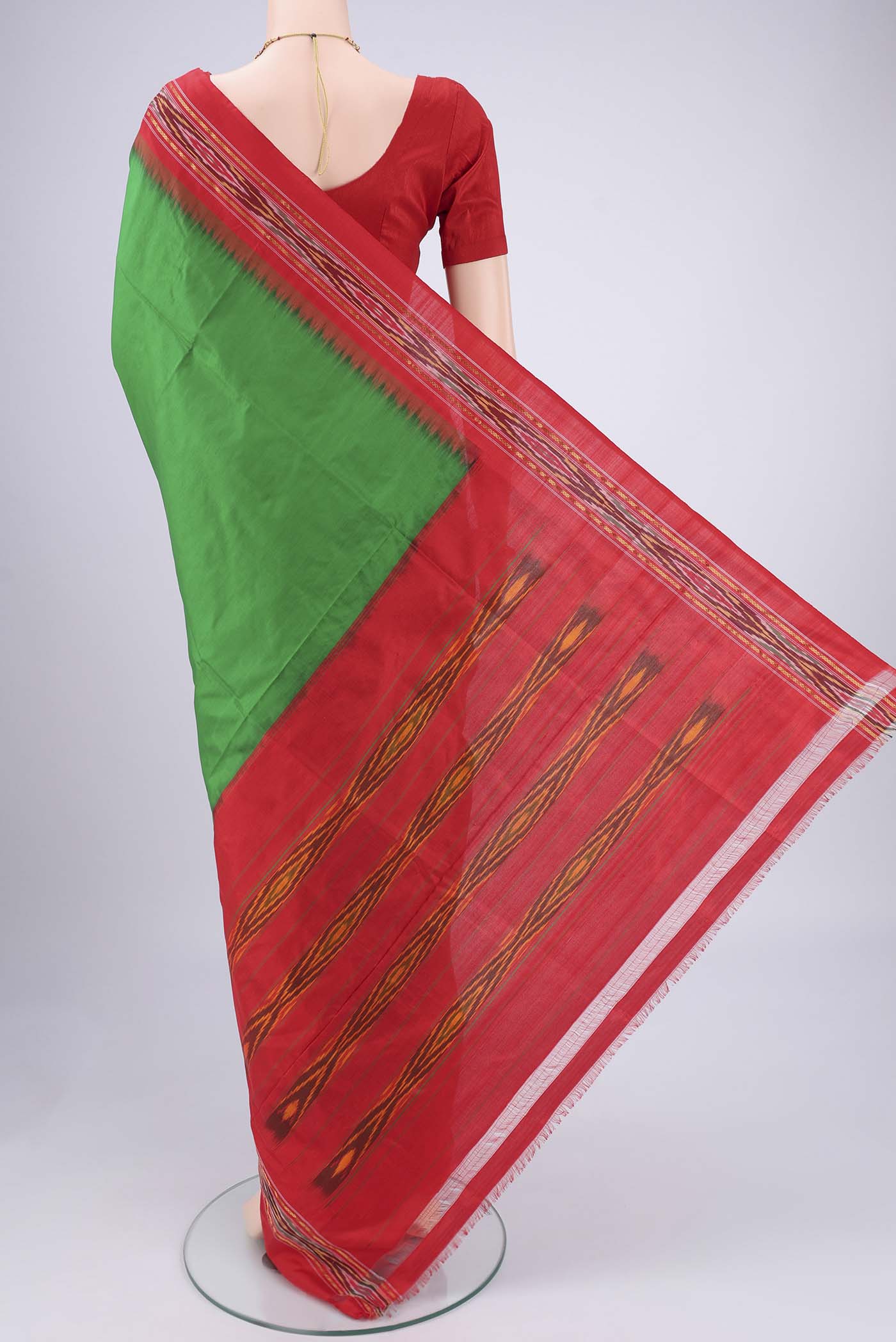 Flat view of Green Pochampally Silk Saree with Plain Body and Ikat Border. 