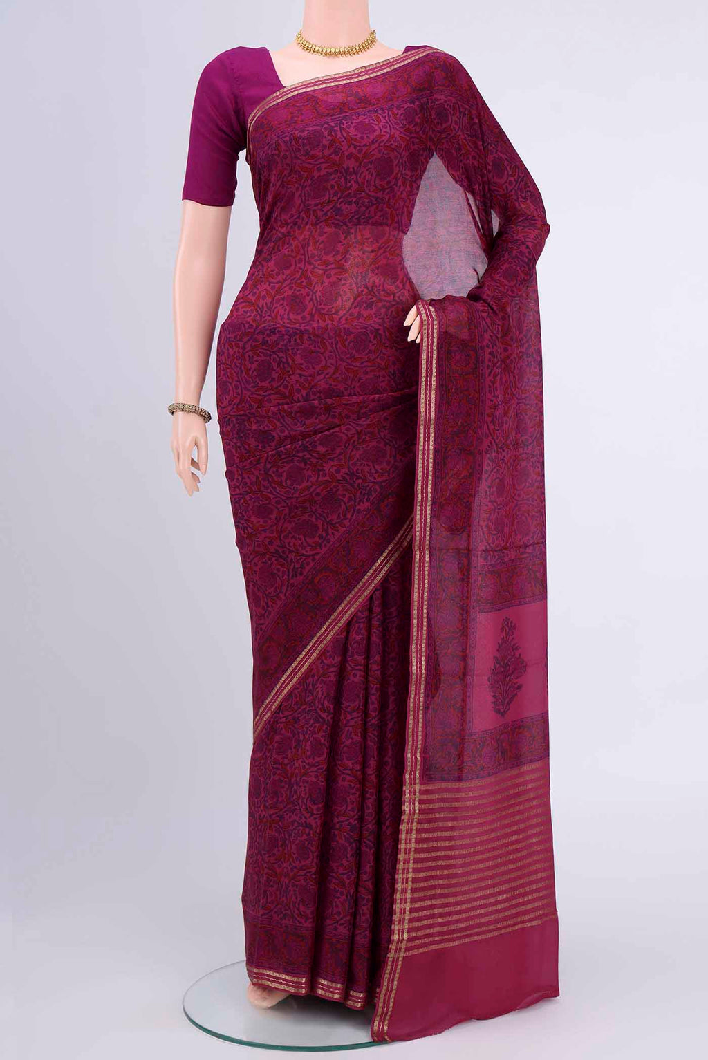 Magenta Mysore Crepe Saree with Floral Print on the body and Printed Border displayed on a mannequin
