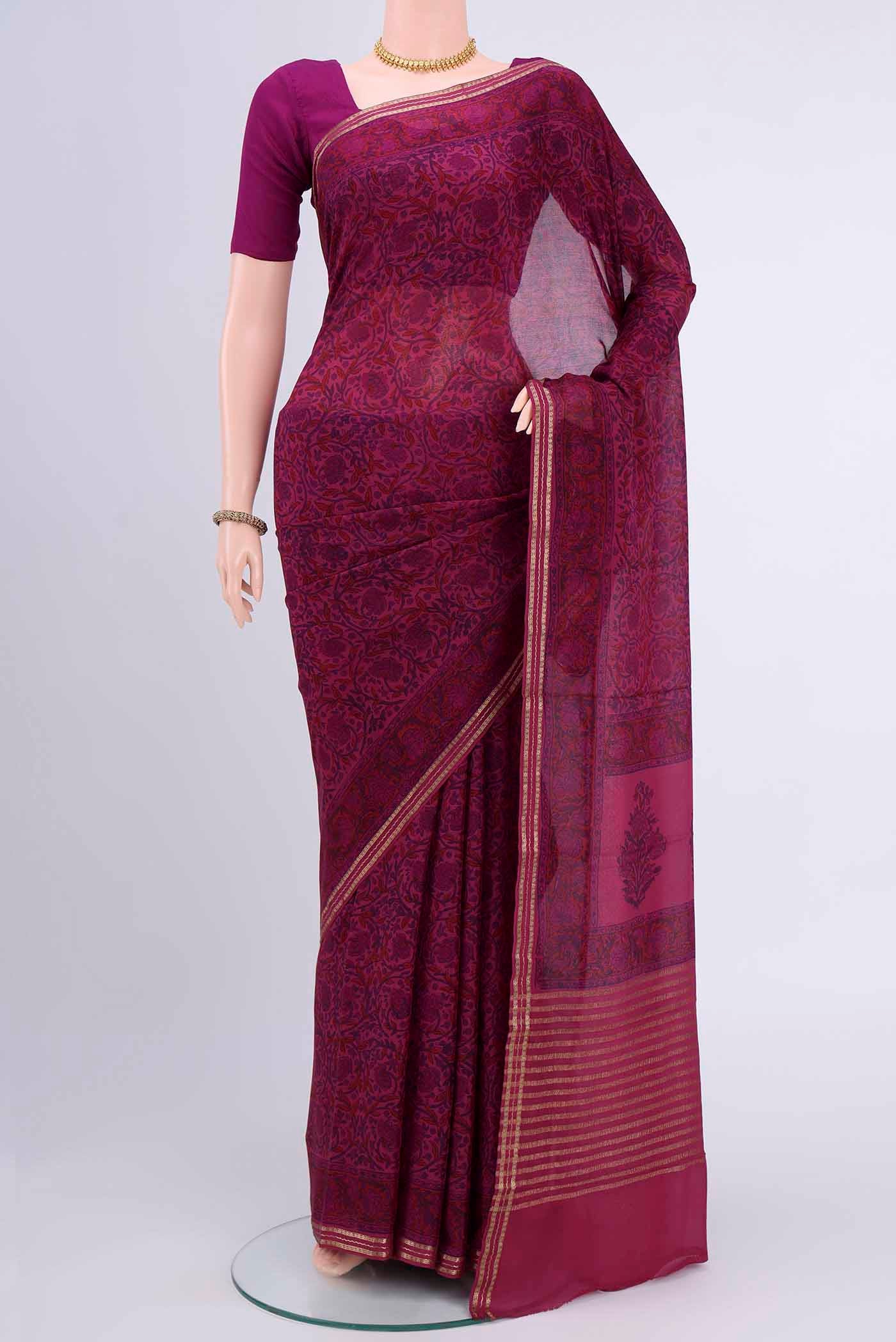 Magenta Mysore Crepe Saree with Floral Print on the body and Printed Border displayed on a mannequin
