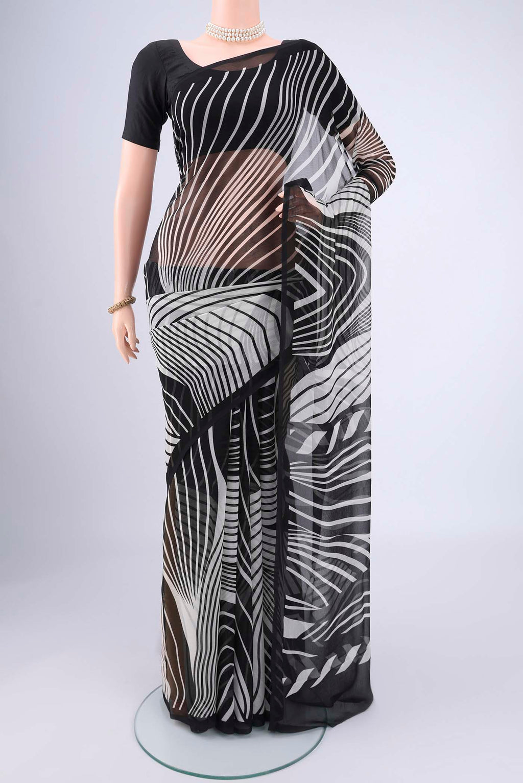 Black Mysore Chiffon Saree with Zig Zag design on the body and Plain Border.  displayed on a mannequin