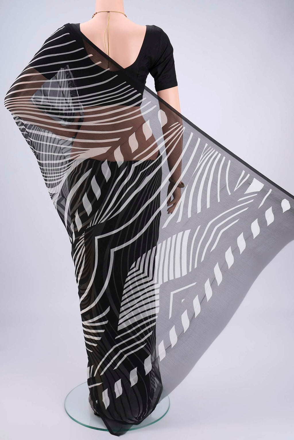 Flat view of Black Mysore Chiffon Saree with Zig Zag design on the body and Plain Border. 
