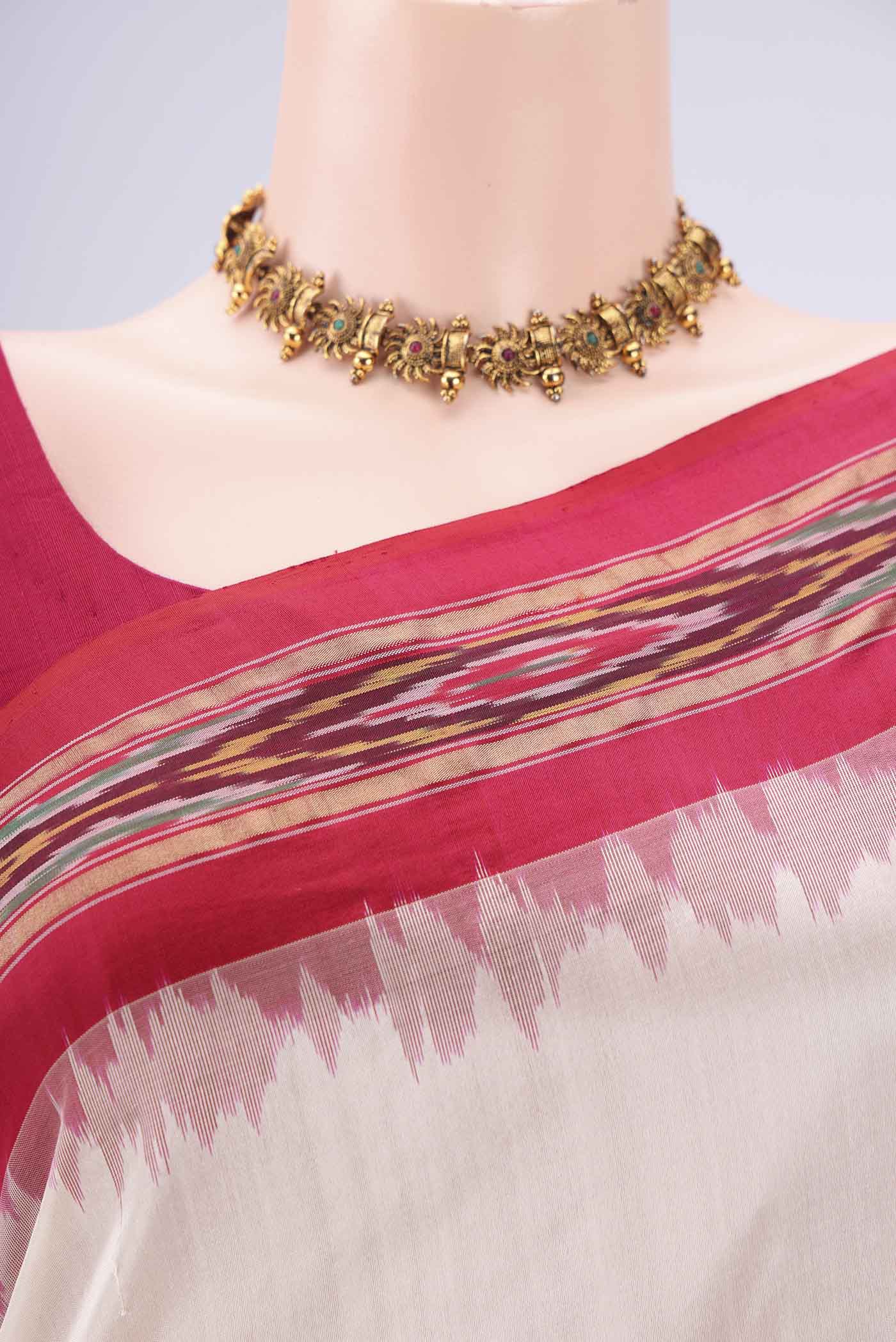 Border image of Off White Pochampally Silk Saree with Plain Body and Ikat Border. 