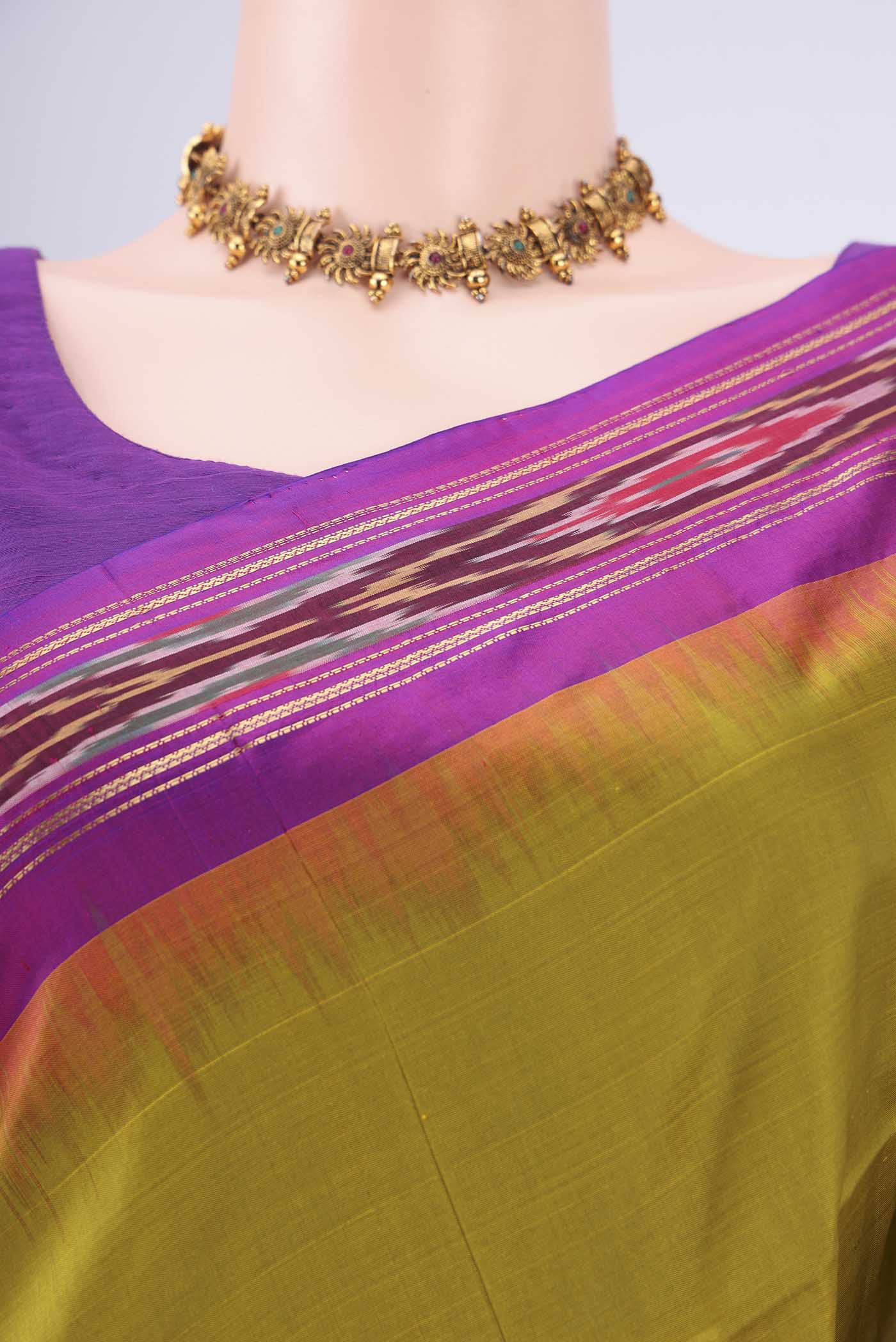 Border image of Mehandi Green Pochampally Silk Saree with Ikat design on the body and Ikat Border. 