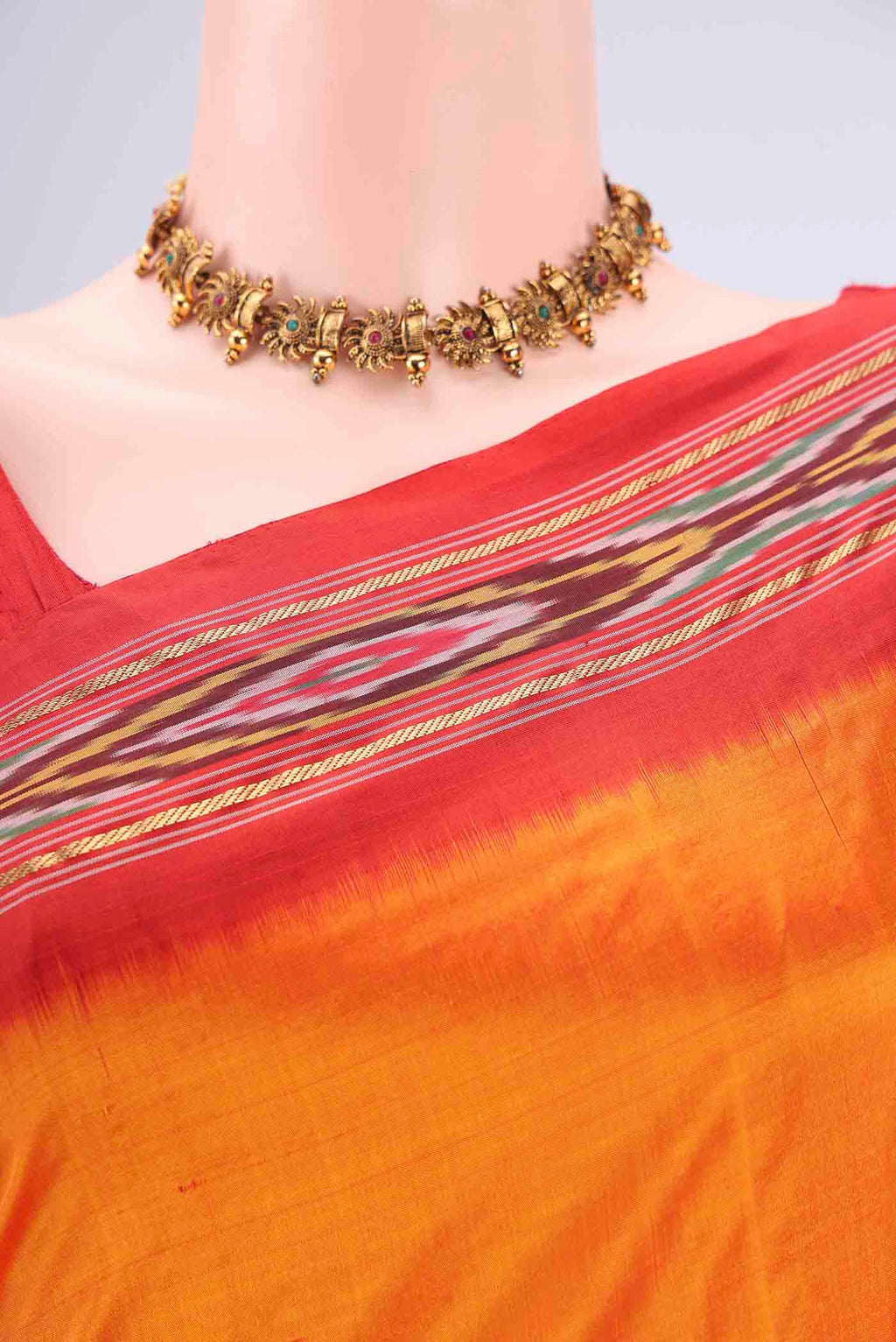 Border image of Orange Pochampally Silk Saree with Plain Body and Ikat Border. 