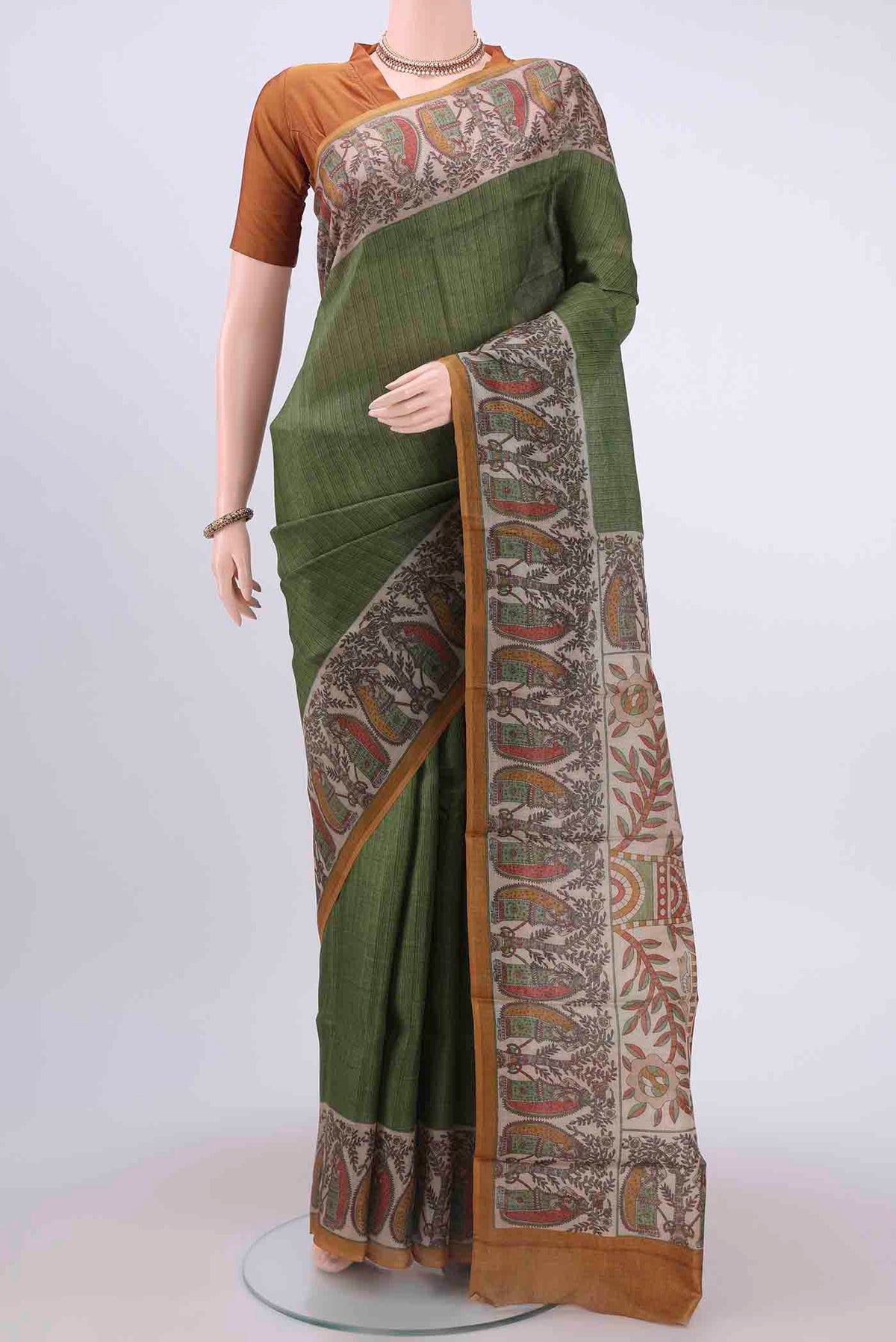 Green Dual Tone Tussar Silk Saree with Printed design on the body and Printed Border displayed on a mannequin