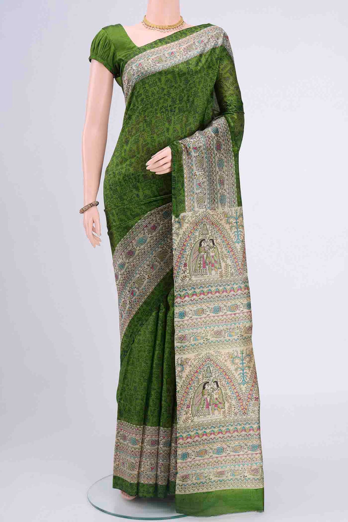 Mehandi Green Printed Silk Saree with Printed design on the body and Printed Border displayed on a mannequin