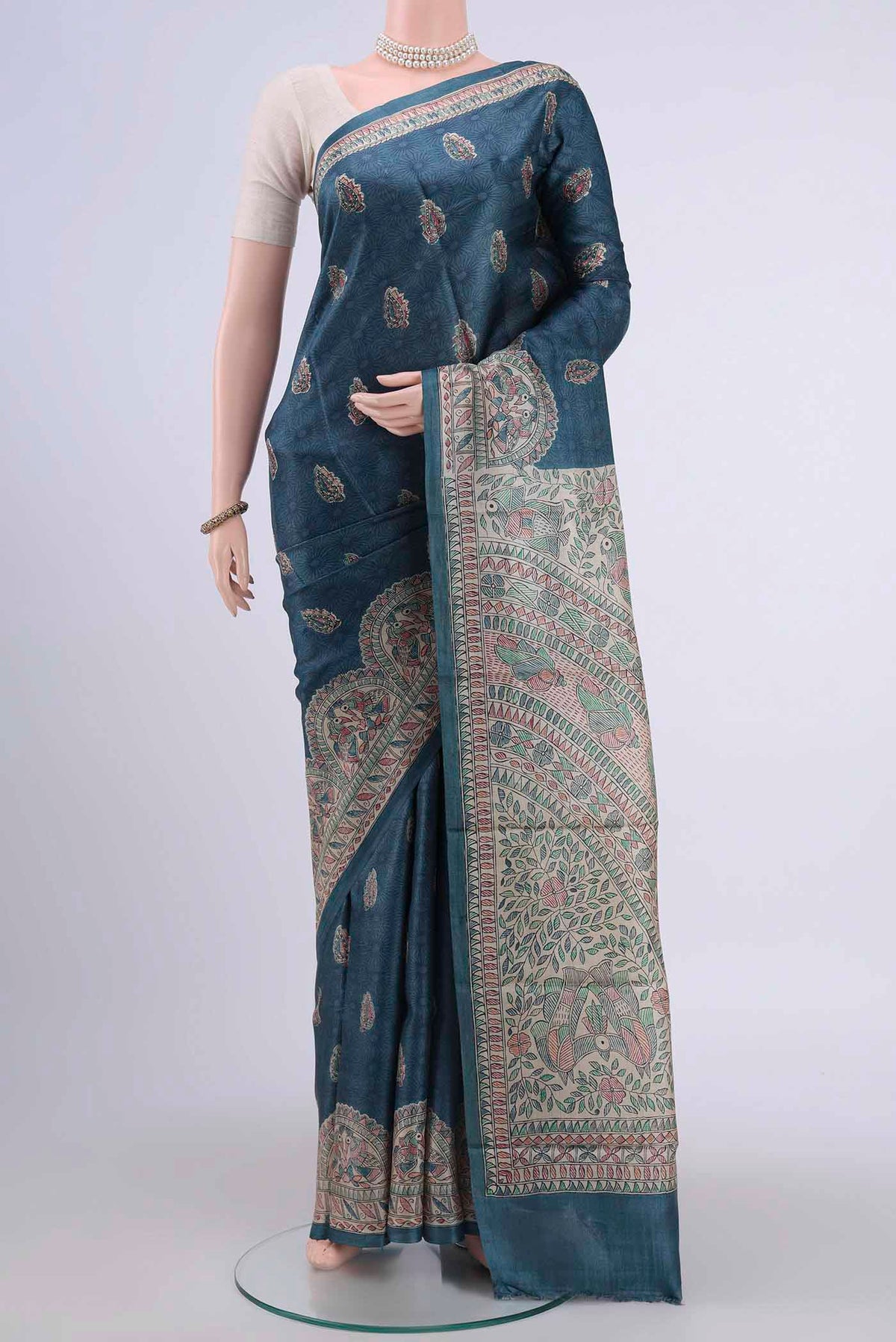 Blue Grey Tussar Silk Saree with Animal Print on the body and Printed Border displayed on a mannequin