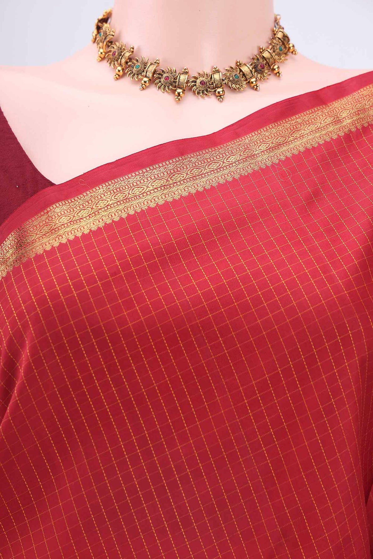 Border image of Red Kanchipuram Silk Saree with Checked design on the body and Zari Border