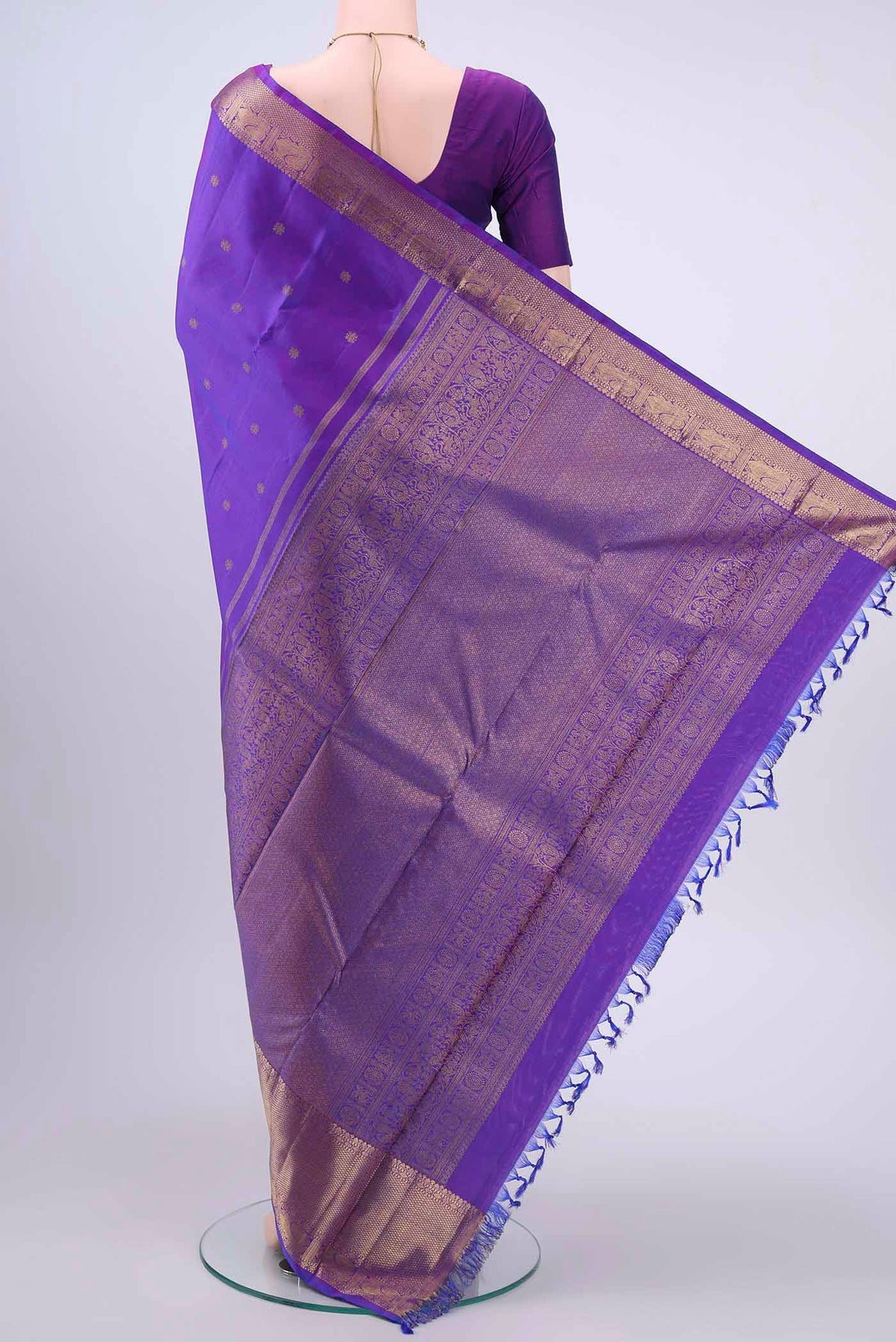 Flat view of Pure Silk Pure Zari Purple Kanchipuram Saree with Zari Butta on the body and Zari Border