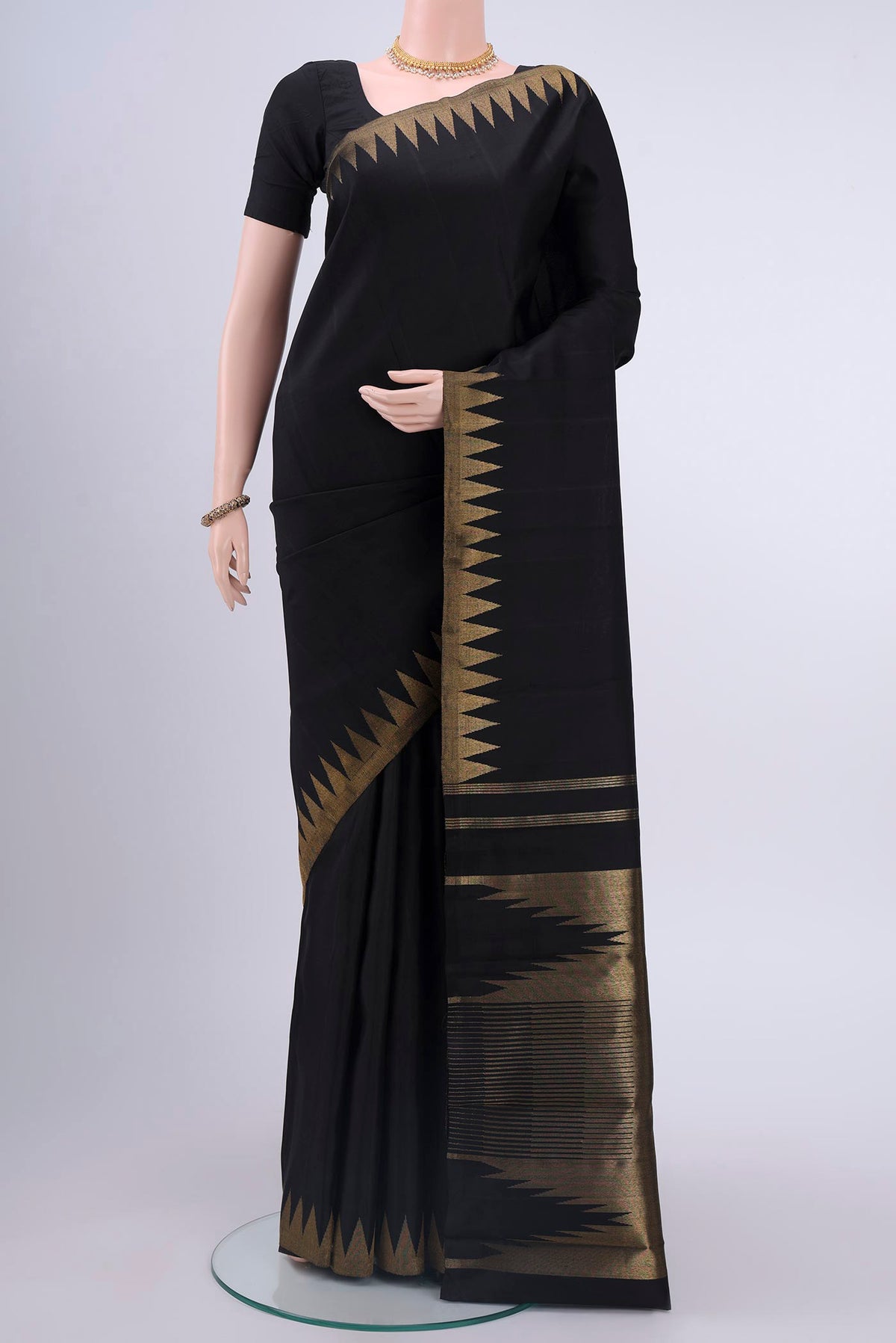 Pure Silk Pure Zari Black Kanchipuram Saree with Plain Body and Temple Border displayed on a mannequin