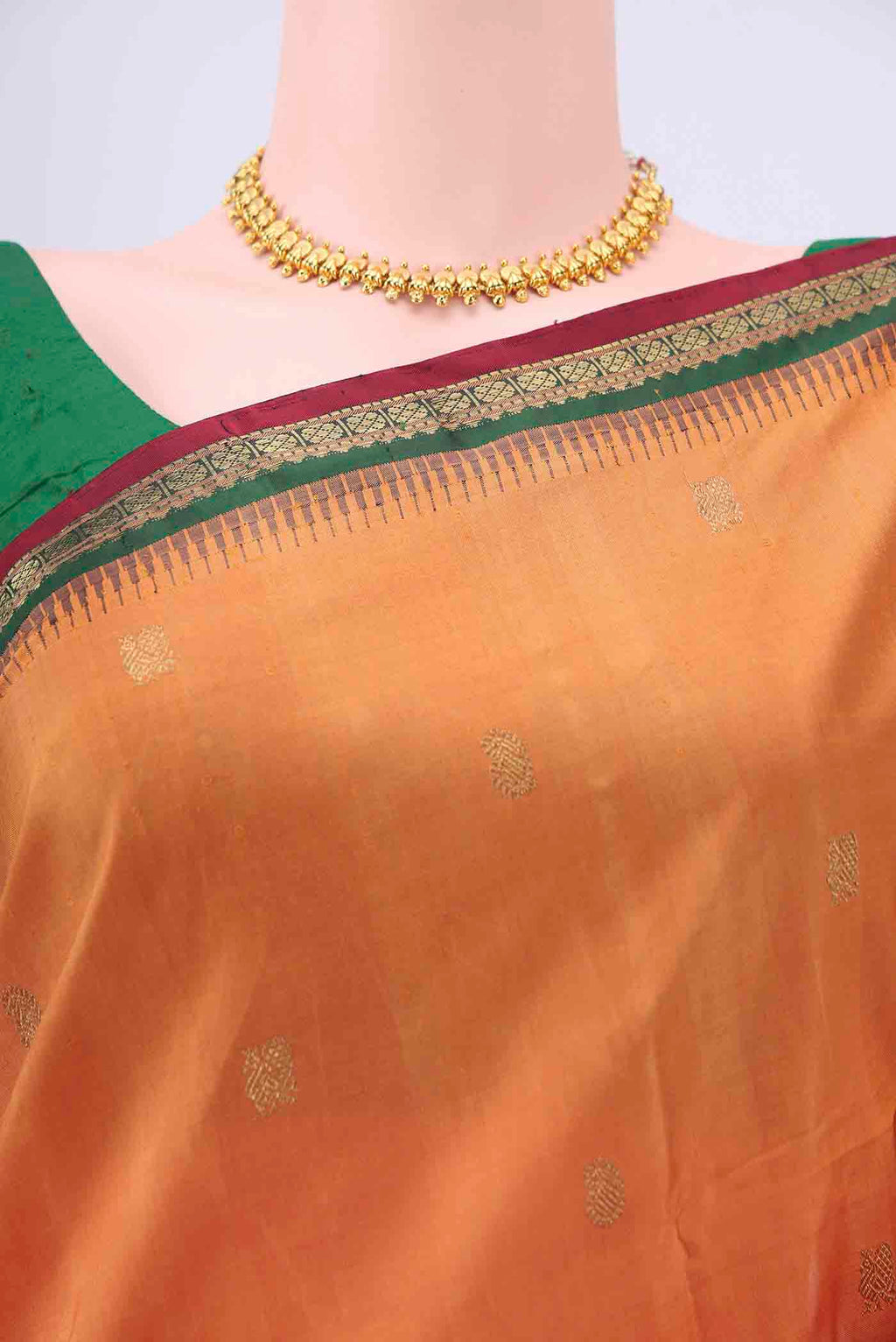 Border image of Brick Orange Kanchipuram Silk Saree with Zari Butta on the body and Zari Border