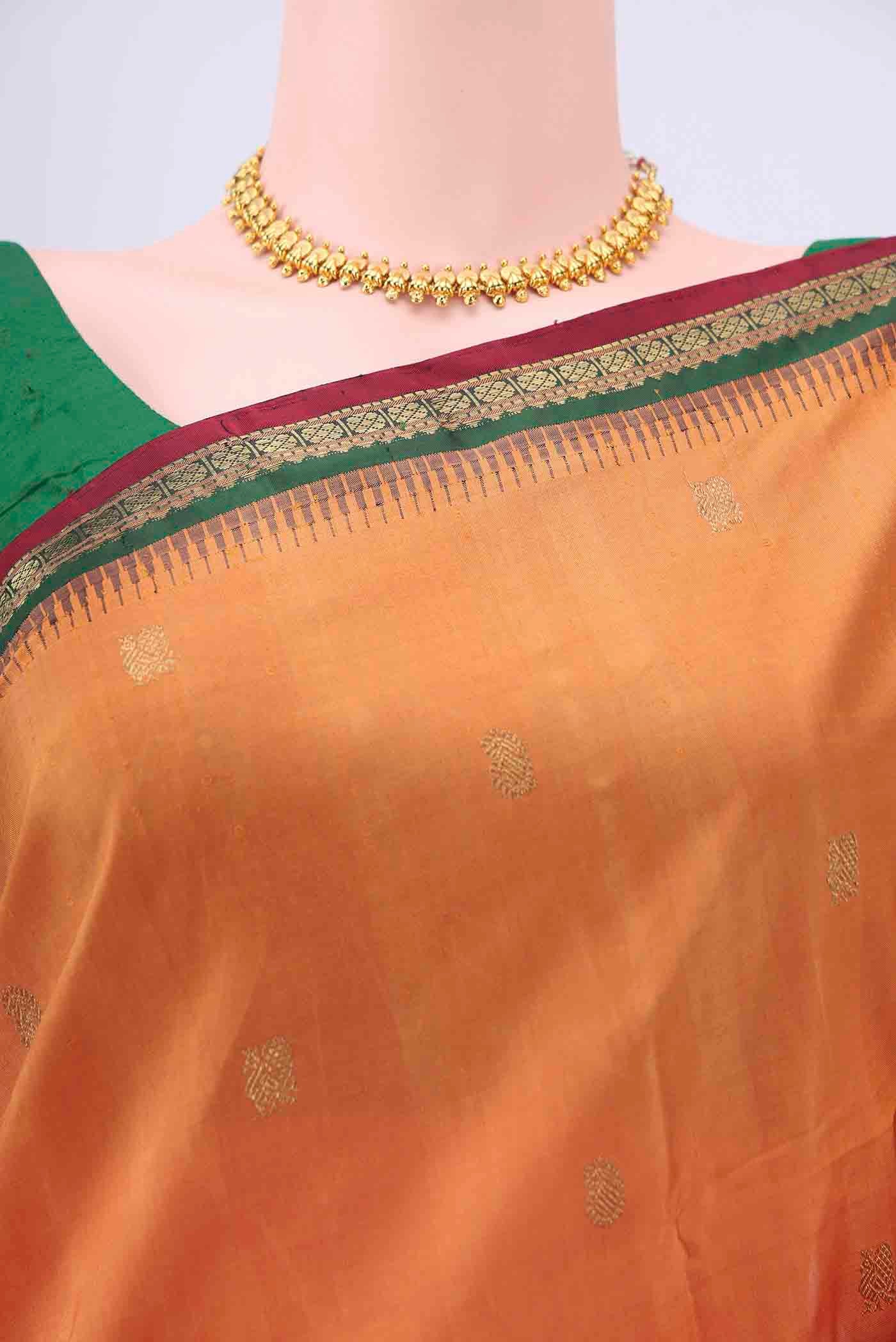 Border image of Brick Orange Kanchipuram Silk Saree with Zari Butta on the body and Zari Border
